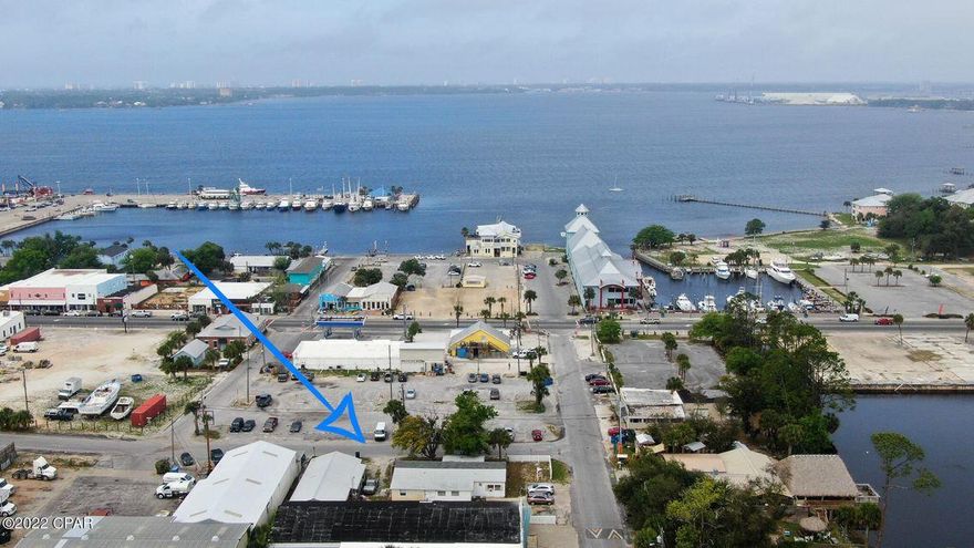 Property was just rezoned to St Andrews Downtown District which allows commercial parking in city parking across the street. Great opportunity for a home in the heart of St Andrews with a warehouse. The possibilities are endless within this .26 acre parcel. The main home is almost 2200 square feet and can be a great AirBnB property or retail. The warehouse is a cinder block building 1675 sq feet in total that can also be converted back to a duplex or continued use for storage.