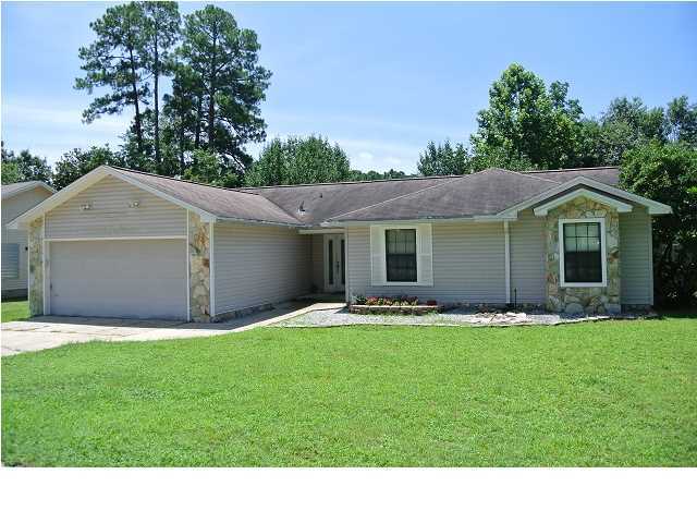 Well kept pool home at the end of a quiet street in the heart of Niceville. The lovely home features tile throughout the main living areas and living areas and dark laminate flooring in the bedrooms. The open concept layout offers an over sized living room with fireplace, nice sized kitchen and a dining room over looking the back yard oasis. The back yard is an entertainers delight with an enormous deck leading to a magnificent salt water pool. It doesn't end there though, the back yard is very spacious and lined by a privacy fence and offers a large storage building. The home also offers ample parking with a circular driveway and additional paring pad for a boat or RV. Pool service is included with the rent. Sorry, no indoor smoking. Pets may be allowed with a $400 non-refundable pet fee
