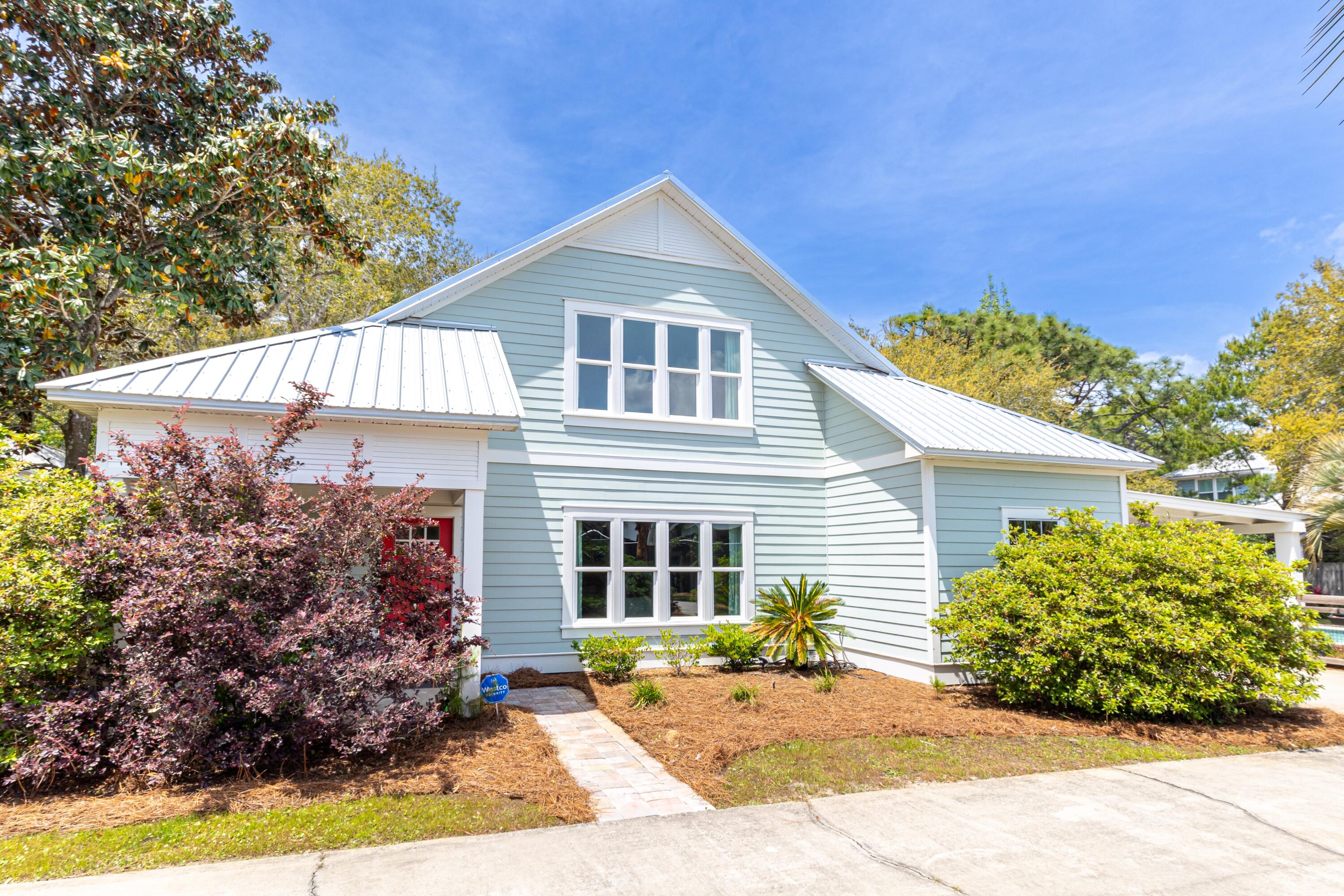 TAKE THE PLUNGE!! COASTAL RETREAT ON 1/2 WOODED ACRE JUST OFF WEST END 30A!! NO HOA!! Just a short stroll from the beach yet privately tucked away in a serene wooded setting, this unique property offers the best of both worlds. Enjoy the tranquil ambiance of nature while being minutes from the shore. The main home offers 4 bedrooms and 3 full bathrooms and features an open-concept layout with abundant natural light and seamless indoor-outdoor flow. The very large upstairs space could easily be reconfigured to add a 5th bedroom. Step outside to your private oasis--complete with a sparkling saltwater pool, sun deck, and lush landscaping. A charming detached cottage house provides additional guest space for a home office, yoga studio, art studio, etc. The half acre lot provides plenty of room to park your RV or boat! Add a garage or pool house! Add a pickle ball, volleyball, or basketball court! In addition to the many expansion opportunities, income opportunities are also very attractive for investors looking for the next property to add to their portfolio! Short term rentals are allowed in this neighborhood! There are multiple options to turn this into an income producing property - turn the whole property into a vacation rental; short term rent the main house while you stay in the cottage; or enjoy the main home while you long term rent the cottage. This property is extremely private and safe, surrounded by mature live oak trees, tucked away from the road and beneath the canopy as if you're in your own little world. Listen to the waves crashing from your screened in porch! Cool off in the pool after a day at the beach! Whether you're entertaining or unwinding, this home delivers the ultimate in comfort, privacy, and that coveted coastal lifestyle. The location is unbeatable - west end 30A is a locals delight, and the home is situated next to the Longleaf Greenway trail head - a popular trail for birding, hiking, and mountain biking! The home is walking distance to Gulfview Heights Regional Beach Access with restrooms, pavillions with picnic tables, showers, and of course the white sandy beaches and emerald green gulf water! Also walking distance to so many eateries and shops along west end 30A, such as Goatfeather's Restaurant, Shunk Gulley, Gulf Place, Growler Garage, Local Catch, and many more! This is truly a unique opportunity, please call me for your private tour, take the plunge and start living the coastal dream today!