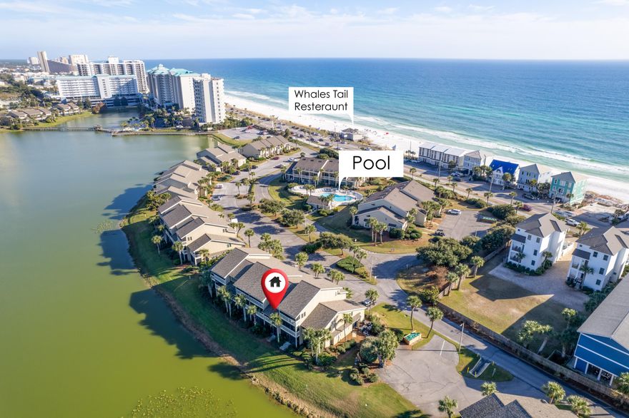 Income producing over $57K rental income last year and $61K in 2021, sold fully furnished, rental ready with bookings in place. You can walk to the beach in two minutes its so close. Gorgeous, peaceful lake is just outside the back porch. A huge pool is 50 yards away, Whale's Tail and the beach are across the street. Just park the car in front of this first floor condo and the relaxing  begins. This successful short term rental called SLOW M'OCEAN  was renovated and refurbished in late 2020. HVAC is just 2 months old, Water Heater is 3 years new, all appliances replaced in 2020. Make sure to click on the pictures and PERFECT VIRTUAL TOUR to see how close this condo is to the beach. Easy walk to beach and great rental income. One of the best values in Seascape with a motivated seller.