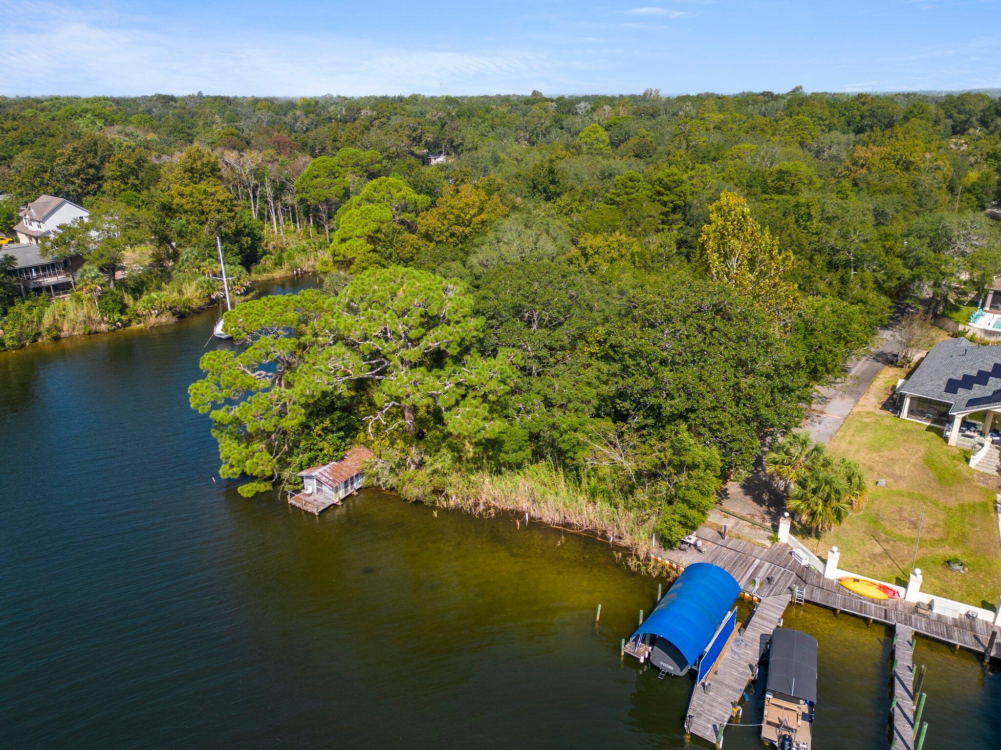 Waterfront property with so many possibilities! Rare find in Niceville 1.3 acres with 100 feet of water access.