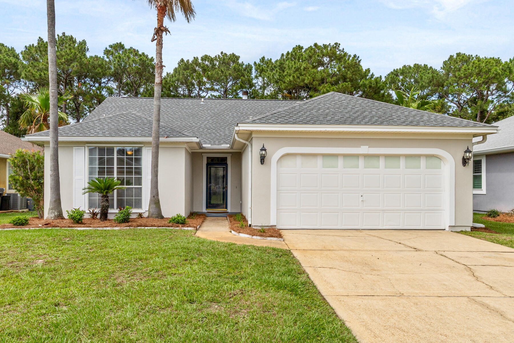 Discover coastal living at its finest with this 3-bedroom, 2-bathroom home in Miramar Beach, just minutes from Highway 98, Silver Sands Premium Outlets, and the white-sand beaches of the Gulf Coast. This home features a spacious living room with a cozy fireplace, a kitchen with ample cabinet space and a breakfast bar, and a private primary suite with dual vanity. Enjoy a fully fenced backyard with an open patio and screened porch. Community amenities include a resort-style pool, tennis courts, a dock, and a park. With its prime location near shopping, dining, and beach access, this home is perfect for enjoying the Florida lifestyle. Schedule your showing today!