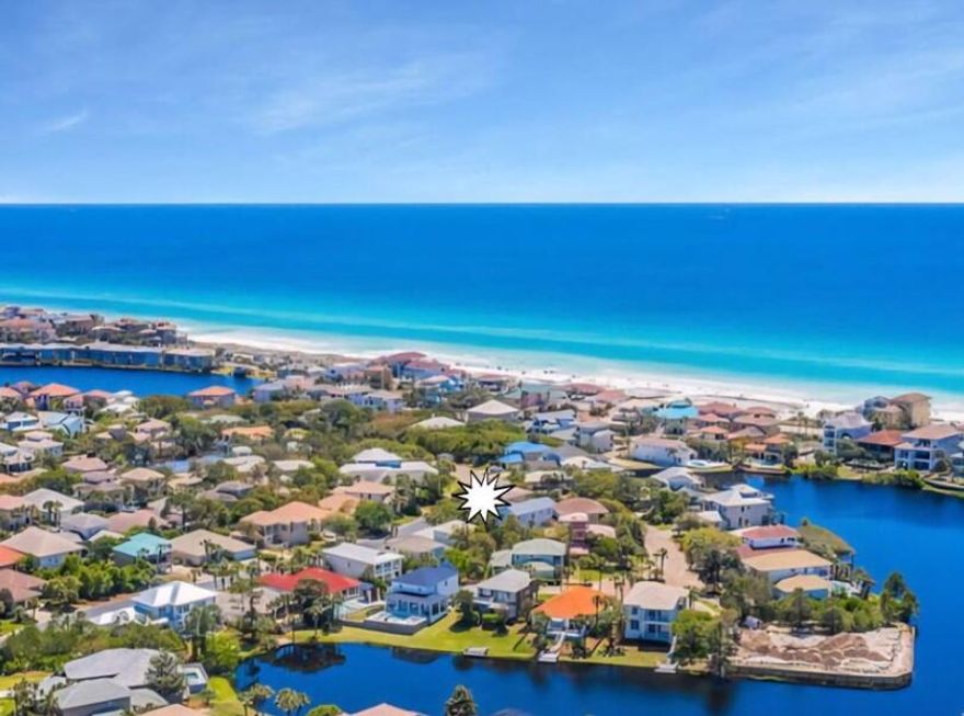 Looking for your perfect second home or beach vacation rental? Look no further, this home is nestled in the gated community of Destiny West, less than a 5 minute walk to the beach or a 3 minute golf cart ride. This beautiful well kept 3 bedroom home has never been rented and shows beautifully. Open floor plan with lots of outdoor entertaining space. Screened in patio off the back & a wrap around porch on front of house on ground & second floor. There is enough room for a small private pool! The kitchen has white Carrera marble countertops, custom cabinetry, Viking gas 5 burner range & other stainless appliances. Guest room with full bath on ground floor, two master suites on second floor, bonus room on 3rd floor with peek-abo look at the Gulf. Completely turnkey!