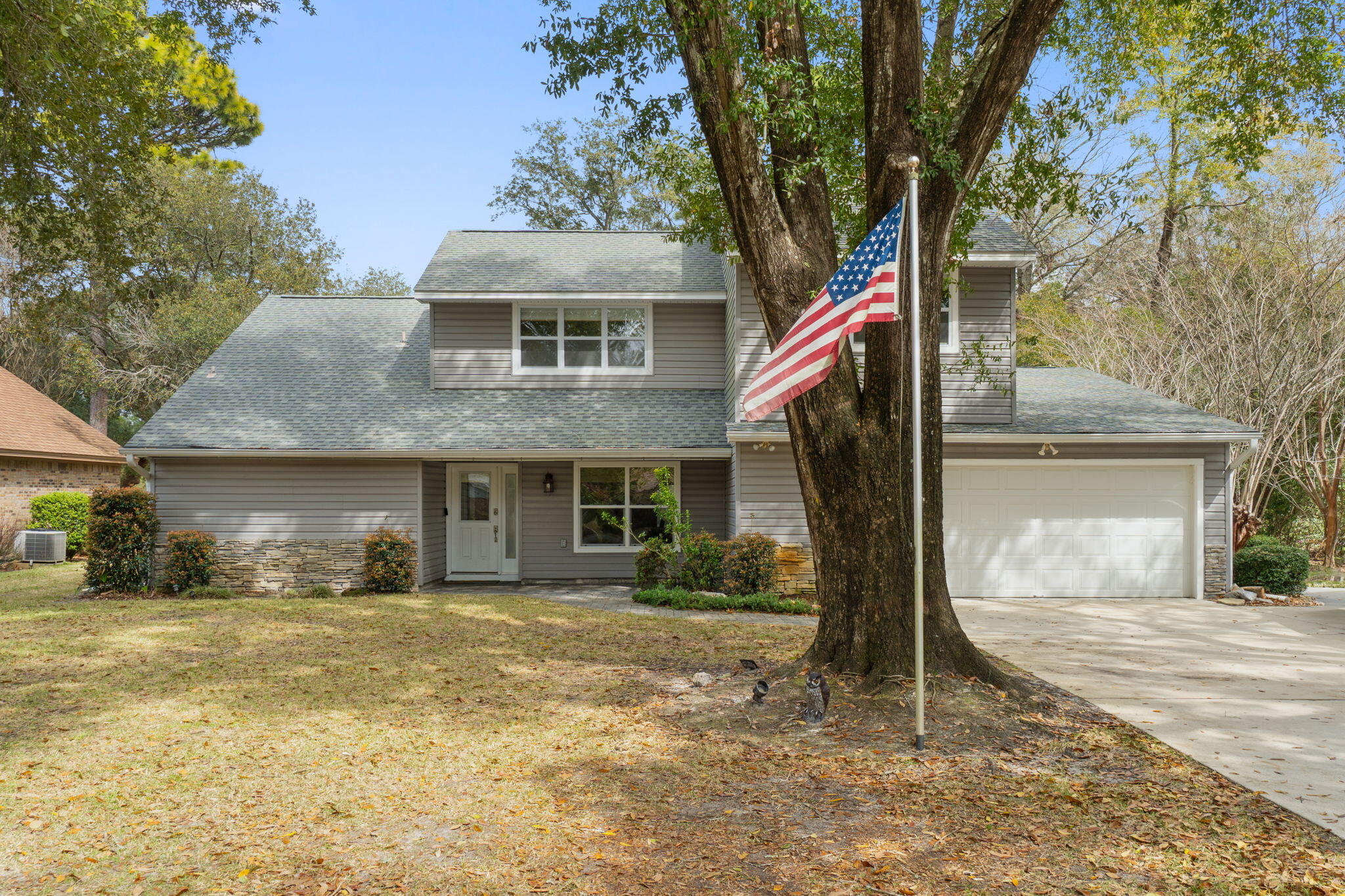 This charming two-story, 4-bedroom, 2.5-bathroom home with POOL is located in the highly sought-after Bluewater Bay community. The kitchen boasts ivory cabinetry with soft-close features and beautiful granite countertops. The main level offers an open and inviting layout, perfect for entertaining guests. A wood-burning, stacked stone fireplace serves as the centerpiece of the living area, while updated lighting and ceiling fans are thoughtfully placed throughout the home. The primary bedroom exudes warmth and spaciousness, with an adjoining bonus space that could serve as a cozy reading nook or a quiet office. The primary bath features two vanities, a beautifully designed tile shower with multiple showerheads, and a generous walk-in closet. A guest bathroom is conveniently located on the main floor.

Upstairs, you'll find three additional bedrooms, two of which share a Jack-and-Jill bathroom. The upper level also includes a versatile flex room with a wet bar, which can be closed off by custom-designed barn doors. Other interior highlights include newer windows and professionally installed closet systems for added storage and organization.

From the kitchen and breakfast nook, your eyes will be drawn to the backyard oasis. The screened-in saltwater pool, installed in 2017, is equipped with both heating and cooling systems, along with a fully animated, smartphone-controlled lighting system. The professionally landscaped front and backyards are equipped with an irrigation system for easy maintenance. Additional features of this home include energy-efficient solar panels, upgraded flooring on first floor, and a garage screen for added convenience. Schedule a showing today!
BUYER TO VERIFY ALL INFORMATION PROVIDED.