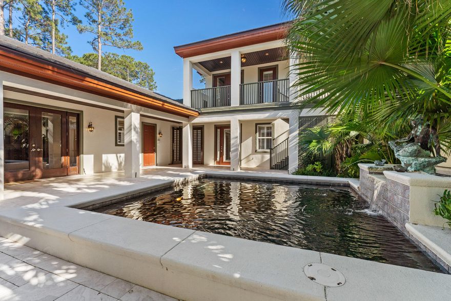 This is an ideal home for the empty nester with two separate living spaces, including a detached guest house. This 3BR/3.5BA home boasts a double gated entrance to a luxury courtyard with heated pool, raised coping, lush landscaping, & built in outdoor fireplace. The main house includes a sizeable kitchen boasting high end appliances, with large island.  Open floor plan with spacious living and dining room leading to a screened porch with views of the lake and the Choctawhatchee Bay in the distance.  Gas fireplace and built in bookshelves in the living & dining rooms.  10 foot ceilings and plantation shutters throughout the main house. The 2 story guest house has a bedroom and sitting room on each floor.  Slate tile roof replaced in 2020.