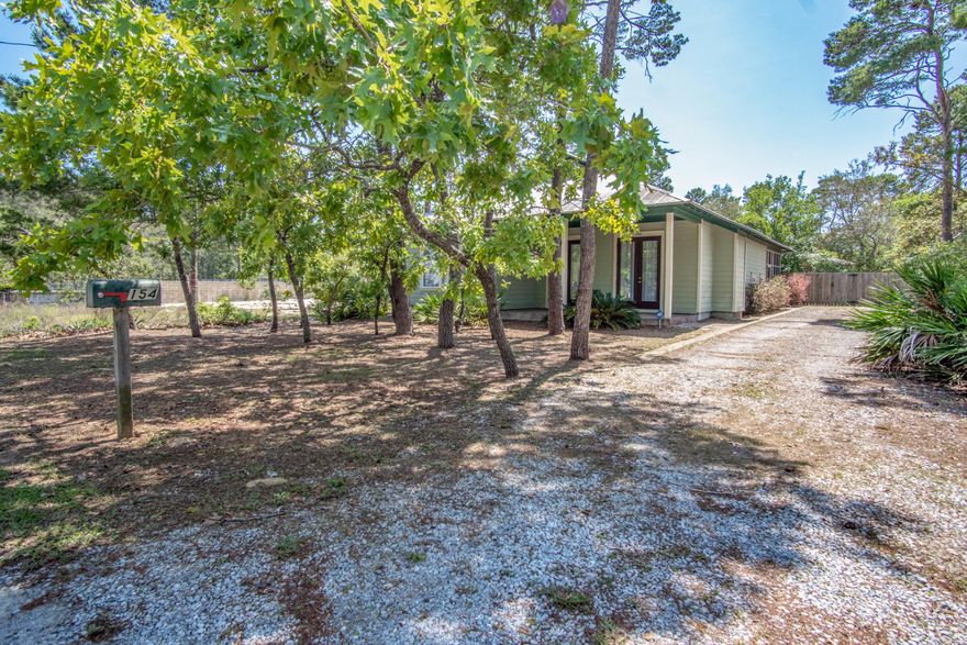 Great 3 bedroom 2 bath home walking distance to public beach access! This cottage home is on a large lot with a fenced back yard great for kids to play - even room to add a pool. There is a screened Florida room off of the kitchen ready for a relaxing while enjoying privacy. The home features 10' ceilings, hardwood floors in the living/dining/kitchen areas. The master bedroom has two spacious walk-in closets and master bath with a separate shower and tub. The dining room has a magnificent chandelier complete with Swarovski crystal. The refrigerator, washer and dryer and window coverings convey with the sale.No Active HOA or dues.Great location east of Hwy 393 at 30A, close to beaches, restaurants and shopping.