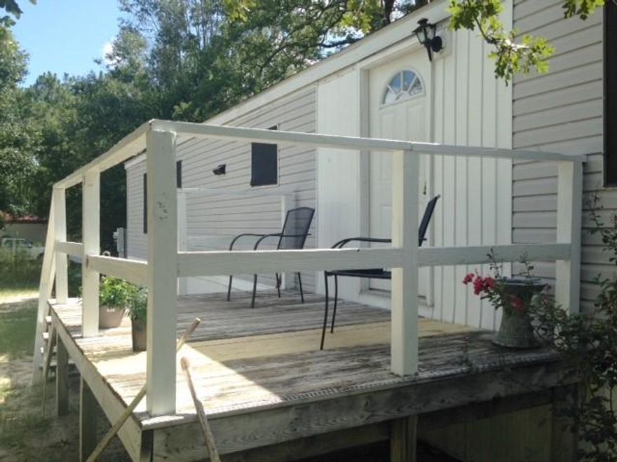 3 BR, 2 Bath MH on 2 lots. Open front porch and back deck. Convenient to town