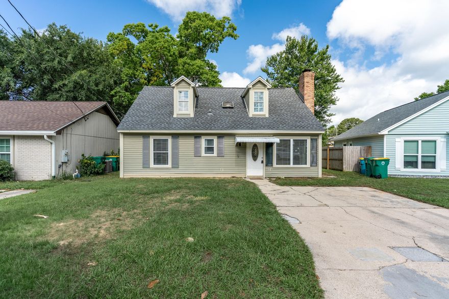 Charming starter home ideally situated in the heart of Fort Walton Beach, just 6.2 miles from Eglin Air Force Base and 7.2 miles from Hurlburt Field. Upon entering, you're greeted by soaring vaulted ceilings, a cozy wood-burning fireplace, and an abundance of natural light. The kitchen offers ample cabinetry and features a recently installed microwave. The laundry room is conveniently located inside the home for added ease. Spacious bedrooms provide plenty of room for your furnishings, while tile flooring throughout ensures a clean, carpet-free living environment. Enjoy your morning coffee or unwind in the evenings on the inviting screened-in porch. Major updates include a new roof in 2022 and an HVAC system installed in 2020.