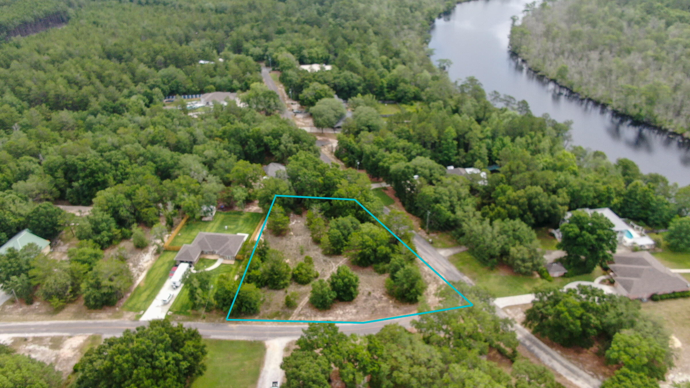 Amazing location! Quiet country feel close to shops, restaurants and activities. Centrally located between Freeport and HWY 331 bridge, just minutes to the sugar white sandy beaches of South Walton. Subdivision is not in an HOA but has covenants to prevent mobile or manufactured homes.Oversized corner lot has plenty of space for your dream home. Situated near the community boat launch to Black Creek. Survey available. Buyer to verify all measurements.