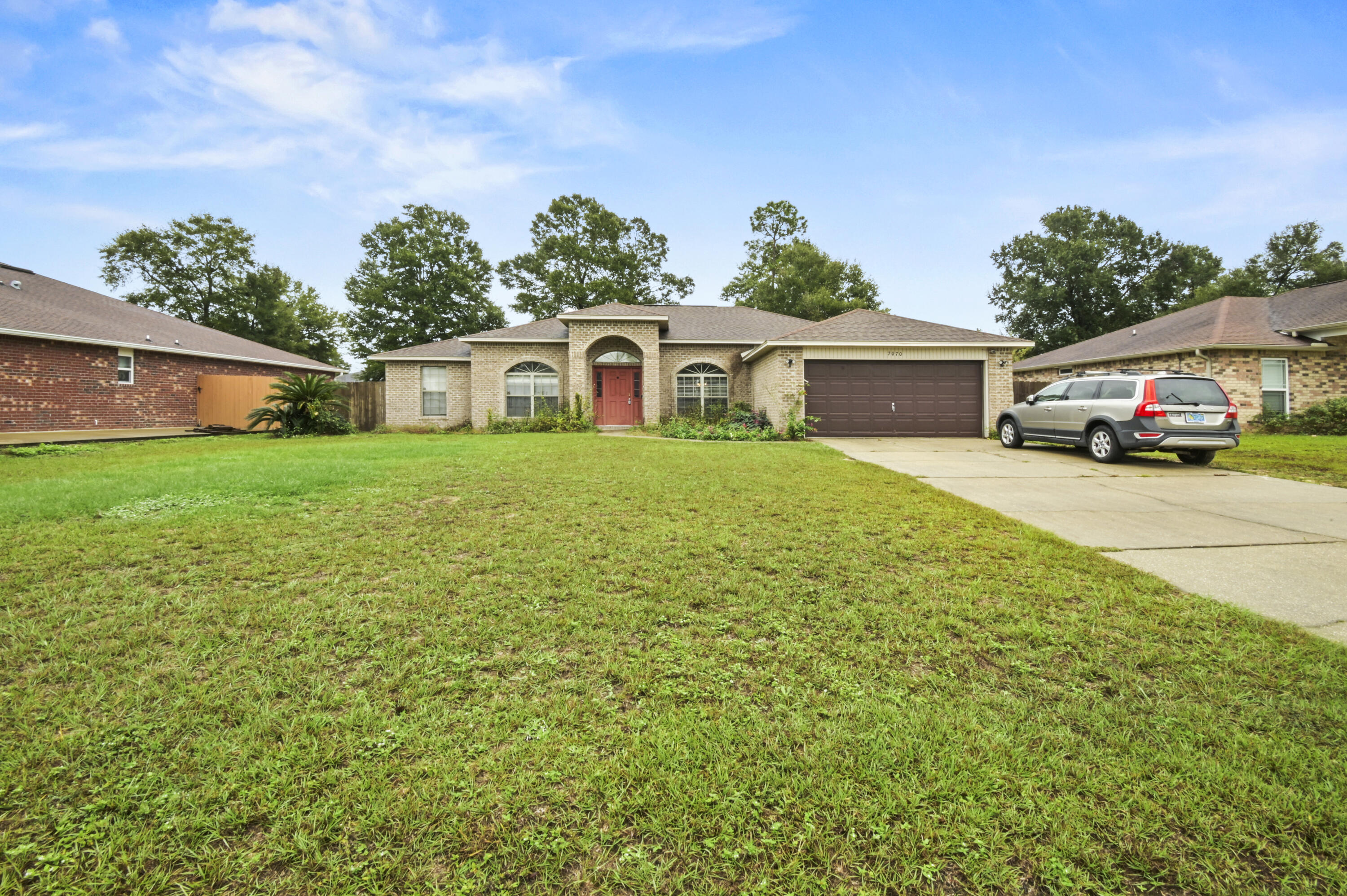 Welcome to this inviting family home, perfectly located just minutes from NAS Whiting Field. Ideal for families or as a rental property, this spacious home combines convenience, comfort, and style. The kitchen, complete with granite countertops, opens to a breakfast nook, making it the heart of the home. A vaulted ceiling enhances the large great room, creating a welcoming gathering space. For more formal occasions, enjoy meals in the formal dining room or use the space as an office.The split floor plan offers privacy, with the large master suite tucked away on one side. The suite features an oversized walk-in closet, a soaking tub, and a separate shower for a retreat from the day's stresses. On the opposite side of the home, three additional bedrooms share a family bath. Outside, a good-sized garden provides room for relaxation and play.
Additional highlights include vinyl windows, wired for surround sound, a two-car garage, and thoughtful design touches throughout. With its ideal location and features, this home is priced to sell, schedule your showing today!