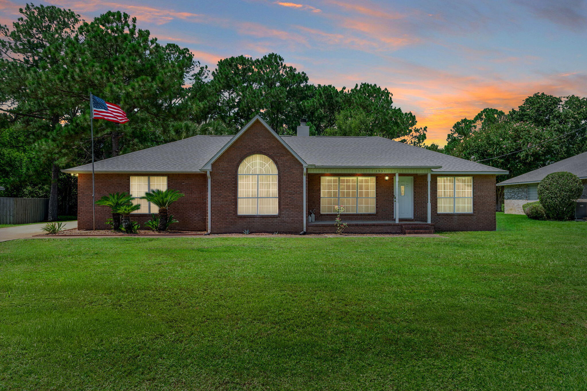 Welcome to this charming and cozy 3-bedroom, 2-bath all-brick home in sought-after Holley by the Sea! With a new roof (2022), a brilliant one-level design, and no carpet throughout, this home blends comfort, style, and easy maintenance. Step inside to find ceramic tile flooring in the entry, kitchen, dining, and baths, complemented by LVP wood floors in the living area. Cozy Fireplace will warm chilly winter nights, The split floor plan offers privacy with a spacious master suite tucked away from the guest bedrooms. The open kitchen flows seamlessly into the dining area, where sliding glass doors lead to a peaceful patio retreat. Outside, escape to your very own oasis of backyard beautifully landscaped with palm trees, a pergola deck, and plenty of room to relax or entertain. Home has tal windows in Master Bedroom and additional bedroom that brings in loads of light; Master Bath has large closet and Door to Water Closet for extra privacy; Ceilings are high to give feel of open spaces; French like doors to outside deck; Beautiful brick fireplace in Living Room; Larger than standard Side garage with double concrete area for additional cars or to exit garage easily; Enjoy all the amenities of Holley by the Sea, center, 3 pools, tennis courts, exercise facility, sauna, pool room and so much more! Enjoy these amenities paired with the charm and functionality of this thoughtfully designed home. Home has an oversized garage for lots of room; Backyard has a natural buffer and foliage along the back of the yard, adding to lots of privacy!