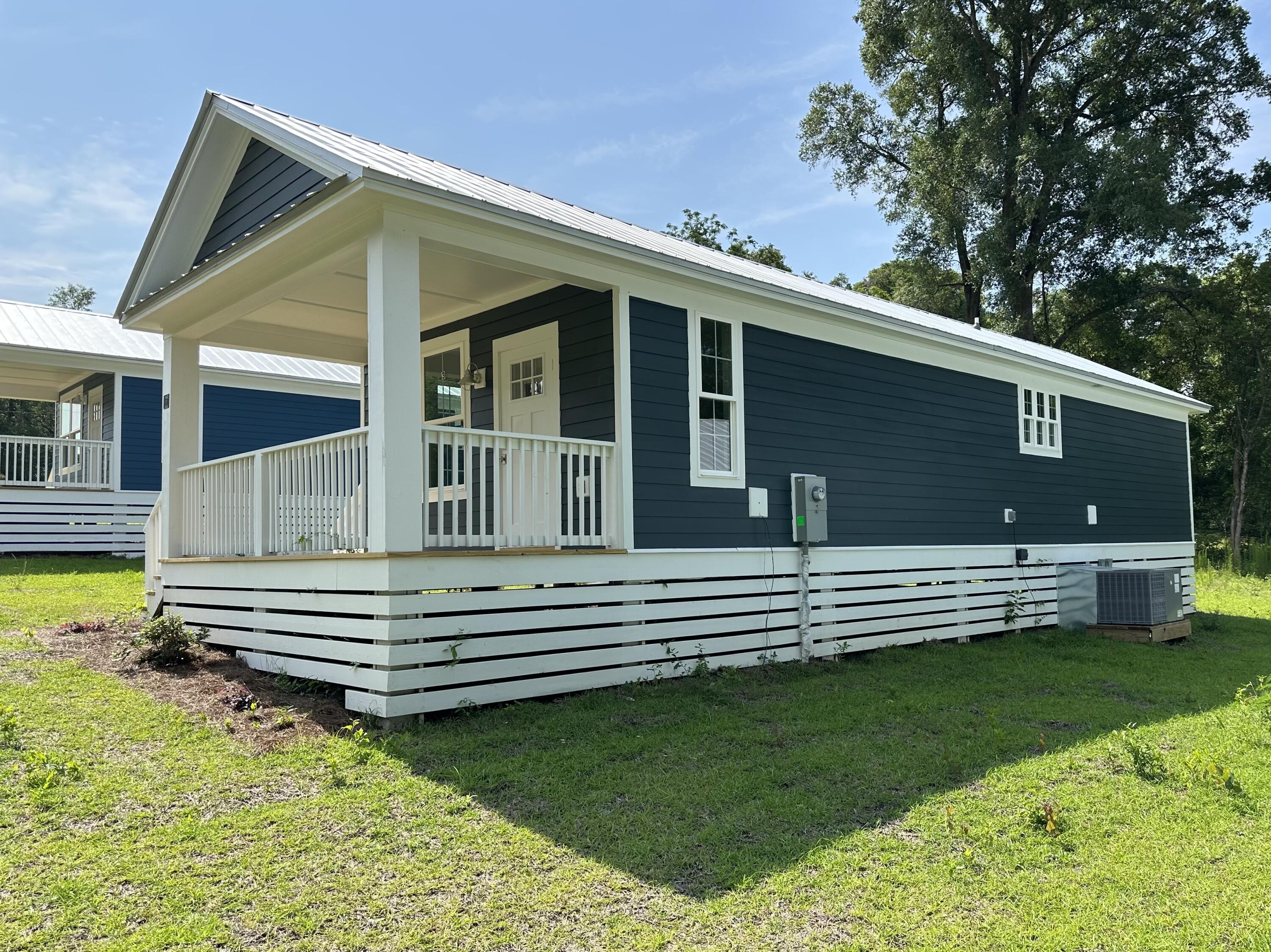 AVAILABLE 4/7/25! Florida cottage style home. This 2 bedroom 2 bath home features vinyl plank flooring throughout the entire home with an open-floor layout. In the kitchen, there are stainless steel appliances, shaker style cabinets & quartz countertops. The bathroom has a stunning floor-to-ceiling tiled shower and walk-in closet. Call today for your private showing!