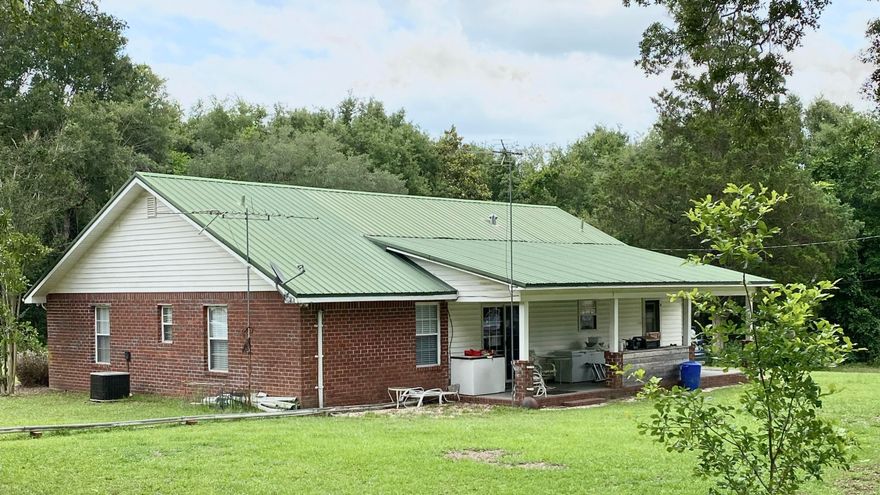 This property boasts around 13.5 +/- acres while still being conveniently located just north of Milton, FL in the Allentown community. Nestled on this large parcel of land is a beautiful home of over 1700 square feet. The back porch perfect for taking in those afternoon sunsets and also leads either into the dining area with a large sliding glass door or into the laundry/mud room for quick clean up. The house has three bedrooms and two baths with a split floor plan. There is a large living area just right for enjoying time with family and friends. The Master Bedroom is very spacious with a large walk-in closet. The master bathroom can be accessed from Master Bedroom as well as from the laundry room. The sixteen acres have lots of potential for gardens, outdoor activities or even expansion on the property. There is also a worship with concrete floor with plenty of storage that has a lean-to for parking any of your outdoor equipment. The property has around 900' of road access to Hwy 87 as well. Call today to schedule your showing. (More photos coming soon)