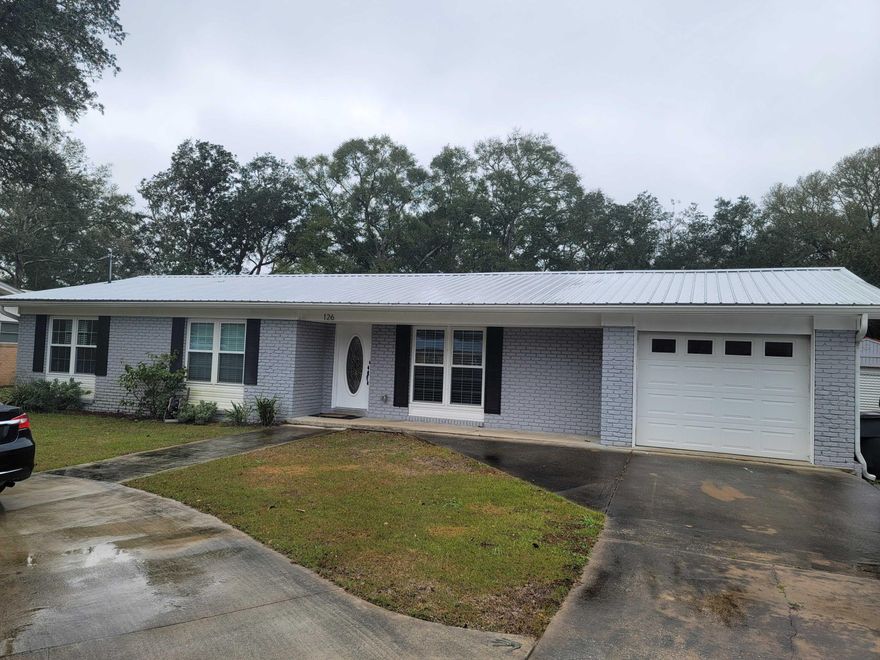 Located just seconds from Ferry Park in East Fort Walton Beach sits 126 NE Fulmar. There is plenty of guest parking in the half circle driveway but for you, feel free to use the garage. As you walk into the house from the garage or the front door, you will be greeted with a large open floorplan with the entire kitchen, living room and dining room in view. This home feels much larger than it's square foot footprint would suggest. The kitchen proudly boasts natural Dolomite countertops, soft close cabinets, and the backsplash to match. The stainless steel appliances include a stove area with a pot filler for making the chef's job a little easier. The living room has plenty of space and the entire home is layered with luxury plank flooring. Right off the the main living spaces is a half bath for you and your guests - no need to go down the hallway to use the restroom. Go ahead, let the spare rooms be a bit messy, nobody will see it! Rest assured, a large chunk of the main components of the home to include plumbing, electrical, HVAC, lighting, windows hot water heater, doors, to include the garage door and irrigation system are only a few years old. The back yard along with the large back patio and deck are great for entertaining guests and it has a large shed with electricity in the back as well as an outdoor shower. Once it's time to retire for the night you will walk by the laundry closet and a two bedrooms on the left and a full bath on the right. The master bedroom is spacious and the master bath includes a dual vanity. Not only is the home amazing but Elliott's Point is one of the most desirable neighborhoods in this side of town for a reason. it's proximity to Ferry Park that includes disc golf, basketball courts, tennis, soccer, playgrounds, a walking/jogging path and so much more. A few short minutes drive to groceries, shopping at Uptown Station and of course, downtown Fort Walton Beach. The powder white beaches are just a few minutes away as well as both bases. This home has so much to offer, don't miss out before it's gone.