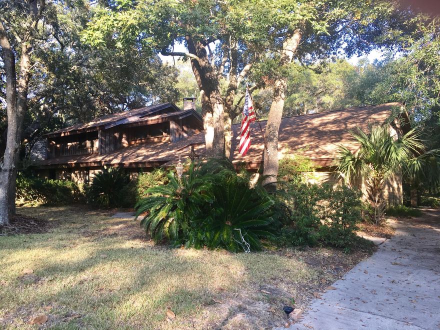 Looking for a large home in a quiet neighborhood? This home is conveniently located near both bases and has easy access to shopping This home boasts great curb appeal is located on a cul-de-sac and has access to water. The lot has mature trees and natural landscaping. There are 2 screened in back porches, one off the master and one off the great room. You really feel like you're out in the country! Get away from the hustle and bustle and check out this great home! Sprinkler system, newer roof, new carpet and beautiful hard wood floors, 2 AC systems, updated kitchen appliances and more storage space than you can imagine. Bring your family home. Love where you live!