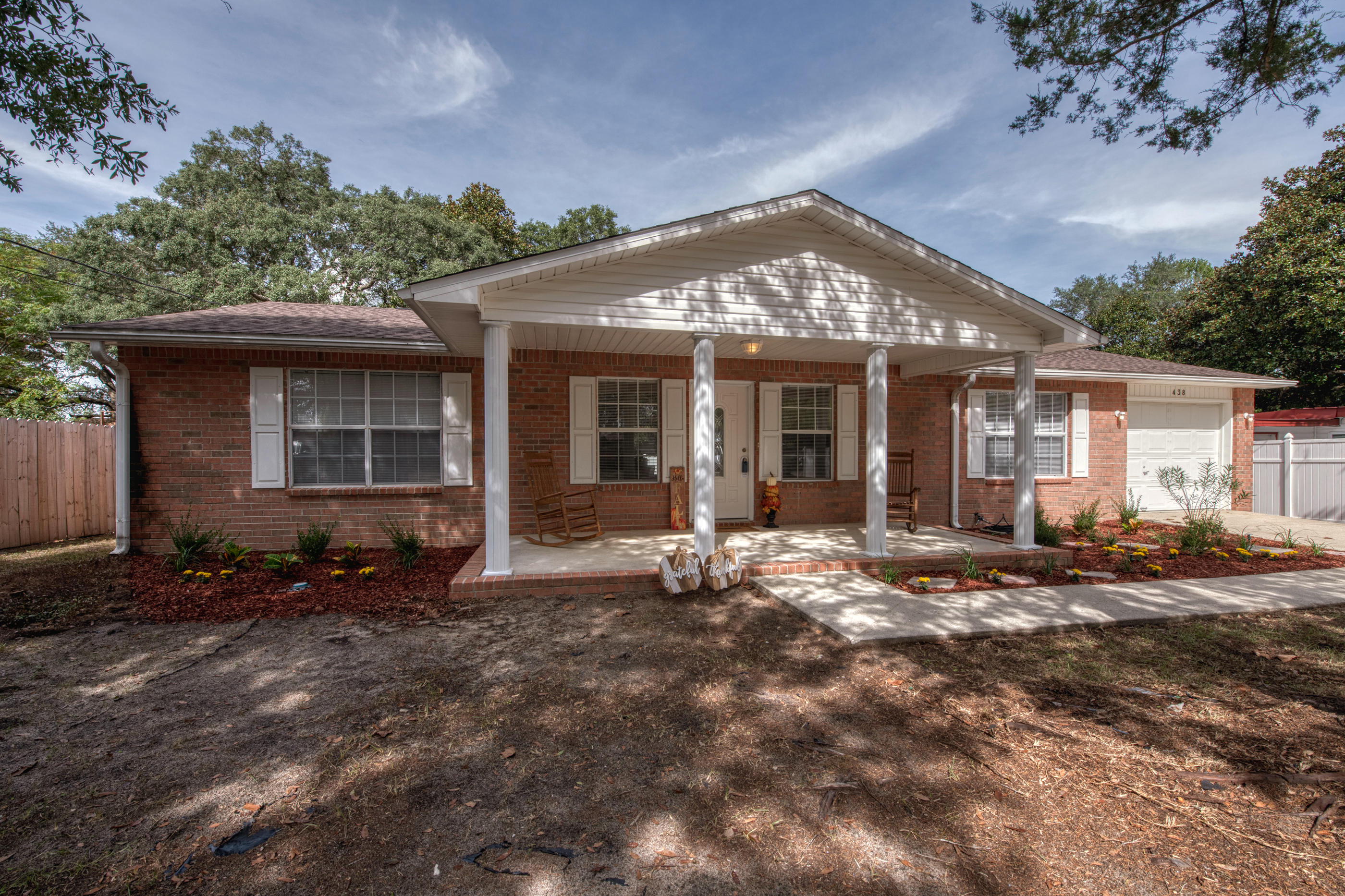 Min away from Eglin AF Bases, North West Florida State Collage Boggy Bayou & Toms Bayou . Cozy up next to fire place or relax on the front porch in a rocking chair. This gorgeous home has a desirable split floor plan with open living and dining. This cozy home feels inviting with it's brand new flooring & paint throughout .There are plenty of upgrades in this home with a New Roof, exterior doors, lighting, GIF ect.... This home come with washer,dryer and 2nd refrigerate in the garage.