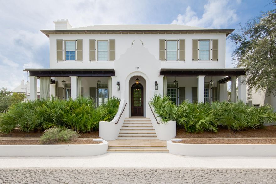 Find stunning coastal elegance throughout this spectacular 3BR/2.5BA Alys Beach villa with a private pool perfectly situated across from the Caliza restaurant/pool and overlooking both Central Park and the nature preserve. Recently renovated, every detail of this home comes together to create a bright and airy beachside retreat. The welcoming front porch leads to a dramatic entryway with an intricate Australian Cypress stairway. The accommodating first story features a spacious living room with a wood beamed ceiling and a gorgeous fireplace, a separate dining room with built-ins and a designer kitchen with beautiful cabinetry, a subway tile backsplash and professional-grade appliances. Enjoy the best of outdoor living in the private rear courtyard with covered dining space, a private rear courtyard with covered dining space, a gorgeous slate patio and a luxe swimming pool with waterfall feature. The second story offers an exquisite master suite complete with fireplace and a luxurious, updated bathroom along with two additional guest rooms and a large full bathroom. An oversized two-car garage with alley access provides additional storage. With its lush green lawns and striking Mediterranean-influenced homes, Alys Beach is an idyllic retreat on Scenic Highway 30A. Based on the principles of New Urbanism, all community amenities are within walking or biking distance and include the zero-entry Caliza Pool, nature trails, parks, an amphitheater, Lake Marilyn and private beach access.