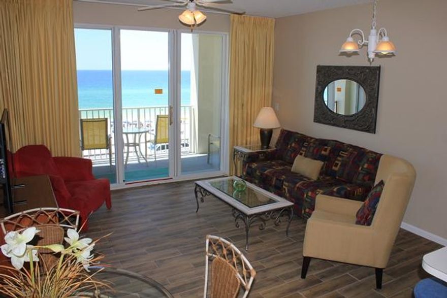 STUNNING SUNSET AND COASTLINE VIEWS FROM THIS CONDO & WRAP AROUND BALCONY!ENJOY INCREDIBLE GULF VIEWS FROM THE LIVING ROOM, PRIVATE BALCONY, DINING AREA, BAR & KITCHEN. KITCHEN LOOKS OUT THROUGH LIVING ROOM TO THE GULF ALLOWING CONVERSING AND ENJOYING THE VIEWS A BREEZE.UPGRADED FLOORING IN LIVING ROOM/DINING AND MASTER BEDROOM INCLUDE THE VERY POPULAR ''WOOD'' TILE FLOORS. MASTER HAS PRIVATE BATHROOM ALSO.HALL BUNKS ACCOMMODATE TWO & A FULL SIZED GUEST BATHROOM HAS A STACKABLE WASHER/DRYER.MAJESTIC SUN OFFERS A RESORT STYLE FEEL WITH A INDOOR/OUTDOOR POOL, FITNESS CENTER, AND MEDIA ROOM/COMMUNITY ROOM FOR OWNERS. SEASCAPE OFFERS AN 18 HOLE GOLF COURSE AND TENNIS COURTS. UNOBSTRUCTED VIEWS FOREVER FROM THIS CONDO! GREAT RENTAL PROPERTY.