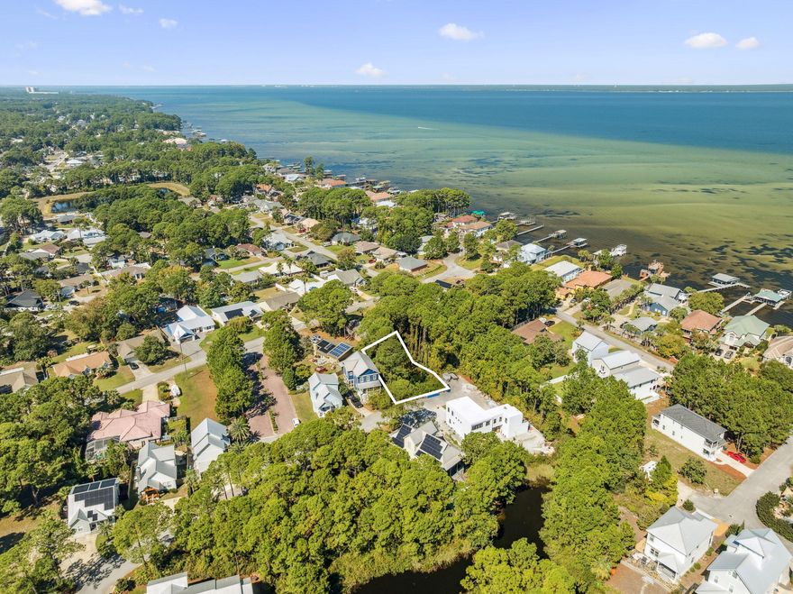 An amazing opportunity to live in a true coastal retreat! This .13-acre lot is perfectly positioned in the charming, low-density neighborhood of Bayshore Pines, just less than a mile from the beach in the heart of Miramar Beach. Enjoy a peaceful setting tucked between the bay and the Gulf, where you can truly embrace the Emerald Coast lifestyle.The property offers exceptional privacy with no through traffic, sits in flood zone X, and comes with a current survey. Best of all, there are no HOA or new buyer fees.You'll also love the unbeatable location--close to Silver Sands Premium Outlets, Seascape Towne Centre, and lots of great restaurant options. Enjoy nearby recreation with two exceptional parks, including one with sweeping bay views and the newly opened Paradise Park, ideal for leisurely walks or outdoor activity.
Don't miss this rare chance to craft your dream home in one of Miramar Beach's most desirable hidden-gem communities!