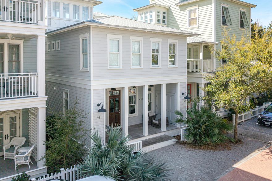 Experience the epitome of coastal living in this exceptionally decorated three bedroom plus sleeping loft cottage, designed for ultimate comfort and style. Featuring gleaming hardwood floors throughout, the open-concept first level offers a cozy fireplace, half bath, and a stunning kitchen. The alluring tiled wall with open shelving is the focal point in the kitchen. A center island offers extra storage and accommodates additional seating for extended family. The white-washed wood dining table seats eight. Induction cooktop and KitchenAid appliances complete the kitchen. Upstairs, enjoy a luxurious master king suite with a spa-like bath and dual vanities, a second king bedroom and a fun bunk room with two sets of bunks share a full hall bath. The third level tower loft provides additional sleeping space with town views. This home features an 8'x19' covered front porch with storage closets, and on-site parking at your back door. Steps from the beach and town square, this property is ideally located near all community amenities, including pools, tennis courts, pickleball, and a fitness center. 