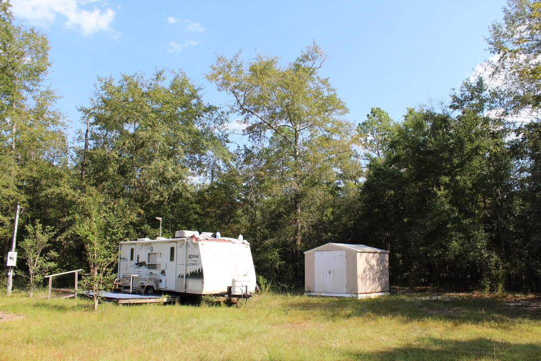 Attention hunters, campers & outdoor enthusiasts! 24 wooded acres (the subject property is surrounded by over 275 acres of natural growth timber).Property includes a 16 foot Kodiak RV with slide out! Well, septic and electric power is hooked up and good to go! small creek runs across a corner of the property. Move in ready for camping, hunting and outdoor fun! shown by appointment. 24 hours notice required.