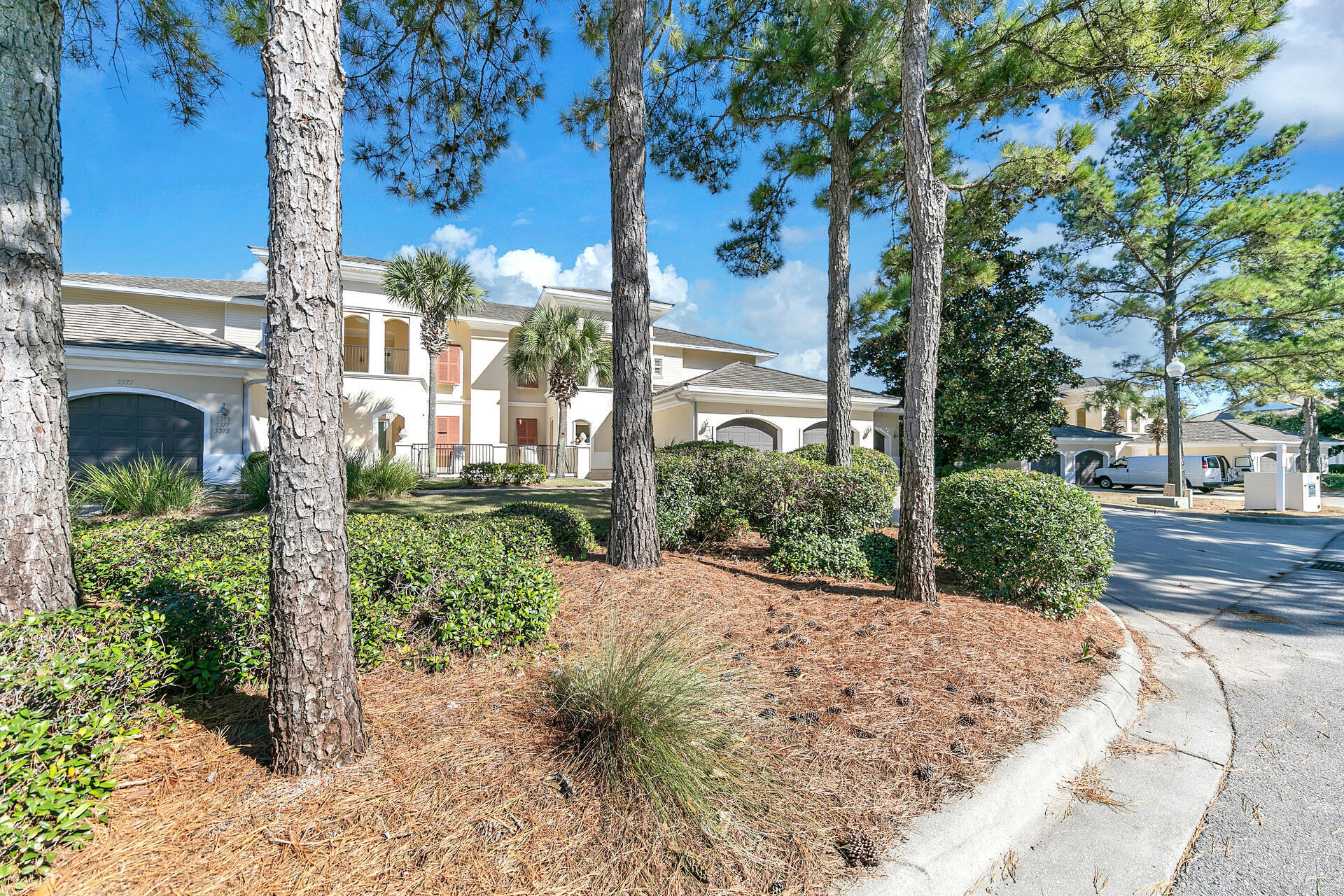 SIX SEATER GOLF CART CONVEYS. This on level condo is located on the beachside of Sandestin Beach Resort. You can pull right into the garage and walk into your beautifully furnished condo. The living, dining and kitchen are very open and great for entertaining with a wet bar. You can enjoy watching the golfers as they tee off on the 13th hole of the Baytowne golf course from the large balcony. The kitchen has granite countertops, stainless appliances and a large breakfast bar. The master suite has a walk-in closet, and the bath has double vanities, a separate shower and a jacuzzi tub. There are also two additional bedrooms with baths. LVP flooring is in the bedrooms and travertine is in the living area, no carpet. The pool is just steps away from the unit. Short term rentals are allowed. There is a large laundry room with an extra sink for cleaning your golf clubs. The unit also has two storage closets in the hall outside the unit. The beach, Grand Boulevard and Baytowne Wharf, which are great for shopping and dining are just a short golf cart ride away. 