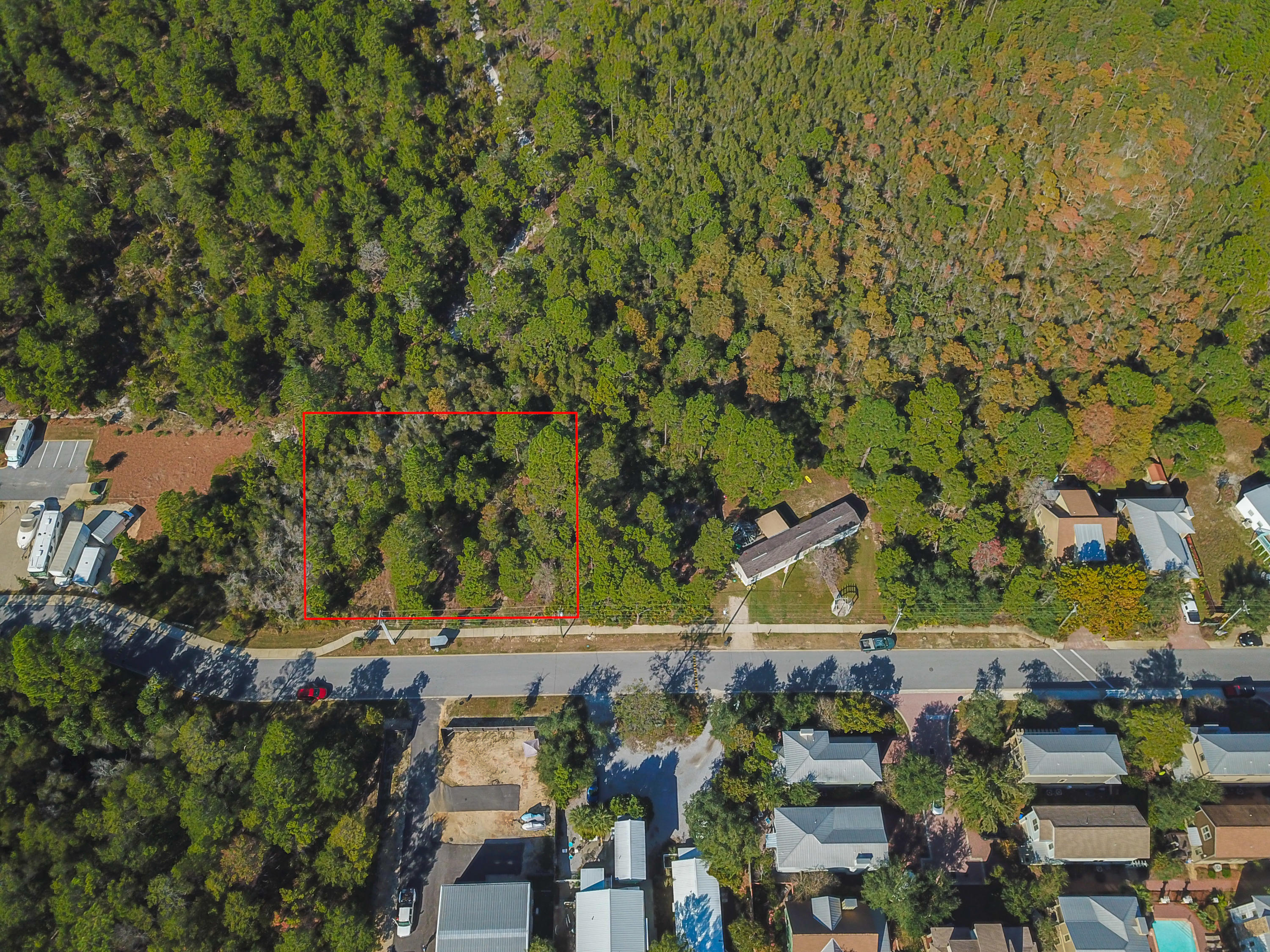 A rare opportunity to purchase just over half an acre of land zoned either Residential OR Commercial in the growing area of North Grayton Beach. This property is located on a paved road with the protected Point Washington State Forest along the northern boundary. The popular Shops of Grayton complex with dining establishments, art galleries and boutique shops is within walking distance while public beach access and the town center at Grayton Beach are less than 1.5 miles away. This property is centrally located to areas of interest along Scenic Highway 30A including the highly rated Grayton Beach State Park, Seaside, WaterColor and more.