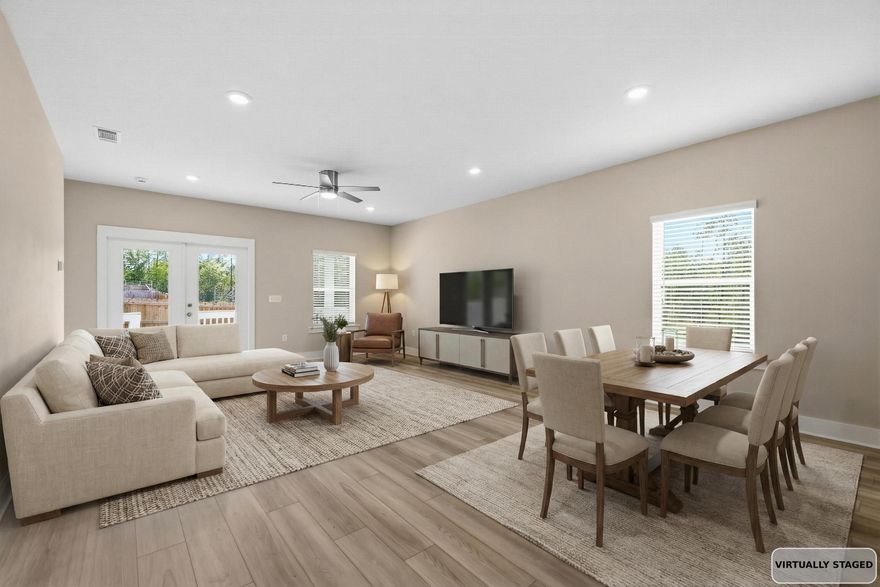 This beautifully maintained 3-bedroom, 2-bath home with a dedicated office sits on a rare corner lot in South Crestview and offers stylish updates throughout. The interior features fresh paint, a designer feature wall in the office, and a beautifully painted kitchen island that adds a custom touch to the heart of the home. The open kitchen is perfect for entertaining with white 42'' cabinets, quartz countertops, a breakfast bar, stainless steel appliances, and a spacious pantry. Laminate flooring throughout the main living areas makes the home both attractive and easy to maintain. The primary suite includes a large walk-in closet, en suite bath with a double vanity, a soaking tub, and a separate shower. The dedicated home office provides the perfect work-from-home setup. EV Car Charger.