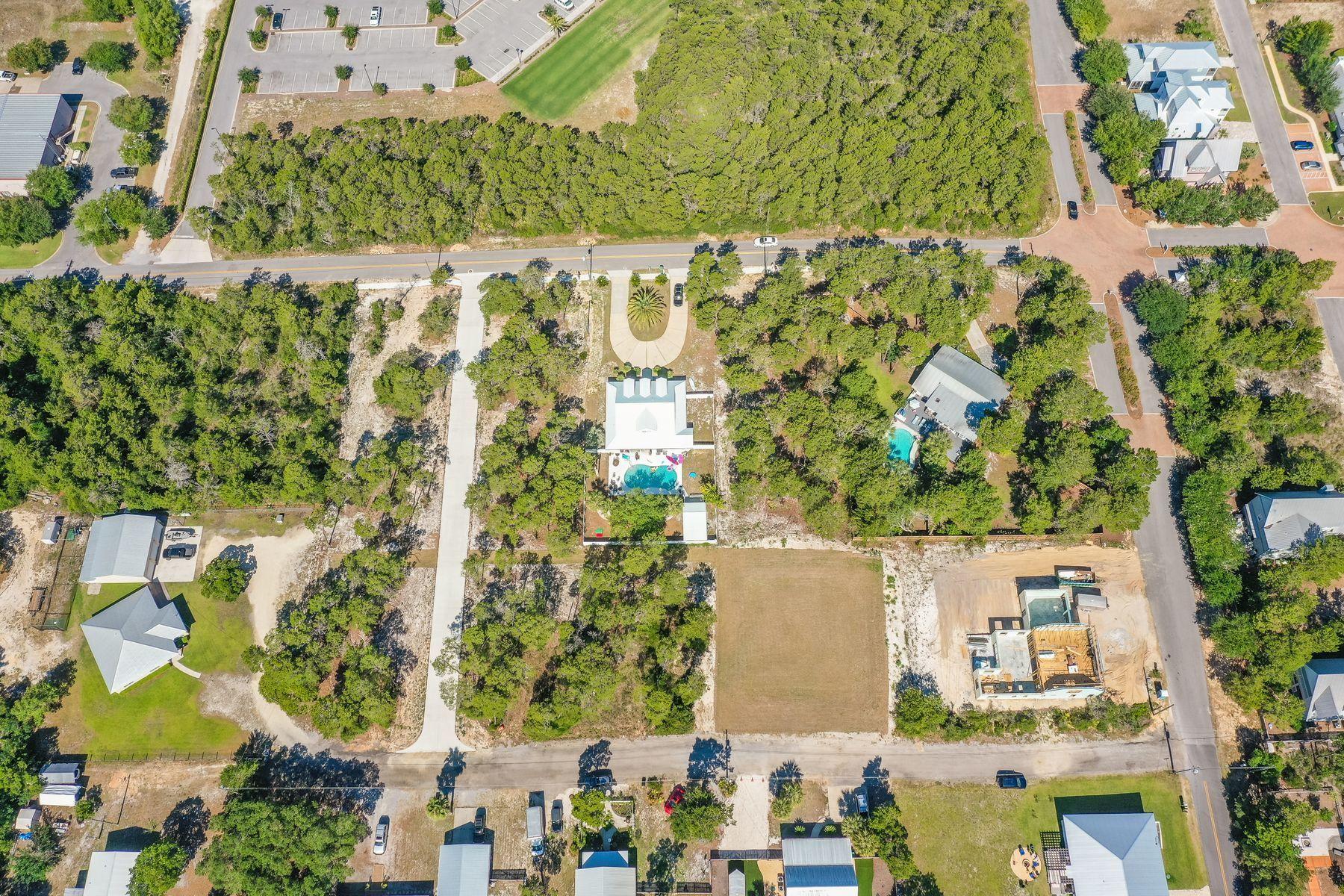 Located in the new development of La Bella Vita Estates, lot 4 is located less than a half mile to the Inlet Beach public beach access and just steps away from the shops and restaurants of 30Avenue. This wooded lot is a 1/3 of an acre and can accommodate a pool, carriage house and up to a 5,000 square foot home. This quiet neighborhood in Inlet Beach offers the conveniences of Rosemary without the crowds. Lake Powell public boat launch is a short two mile distance from this lot. Whether it is lake or beach living you desire, both are just moments away from this unique property.
