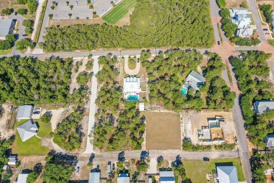 Located in the new development of La Bella Vita Estates, lot 4 is located less than a half mile to the Inlet Beach public beach access and just steps away from the shops and restaurants of 30Avenue. This wooded lot is a 1/3 of an acre and can accommodate a pool, carriage house and up to  a 5,000 square foot home. This quiet neighborhood in Inlet Beach offers the conveniences of Rosemary without the crowds. Lake Powell public boat launch is a short two mile distance from this lot. Whether it is lake or beach living you desire, both are just moments away from this unique property.
