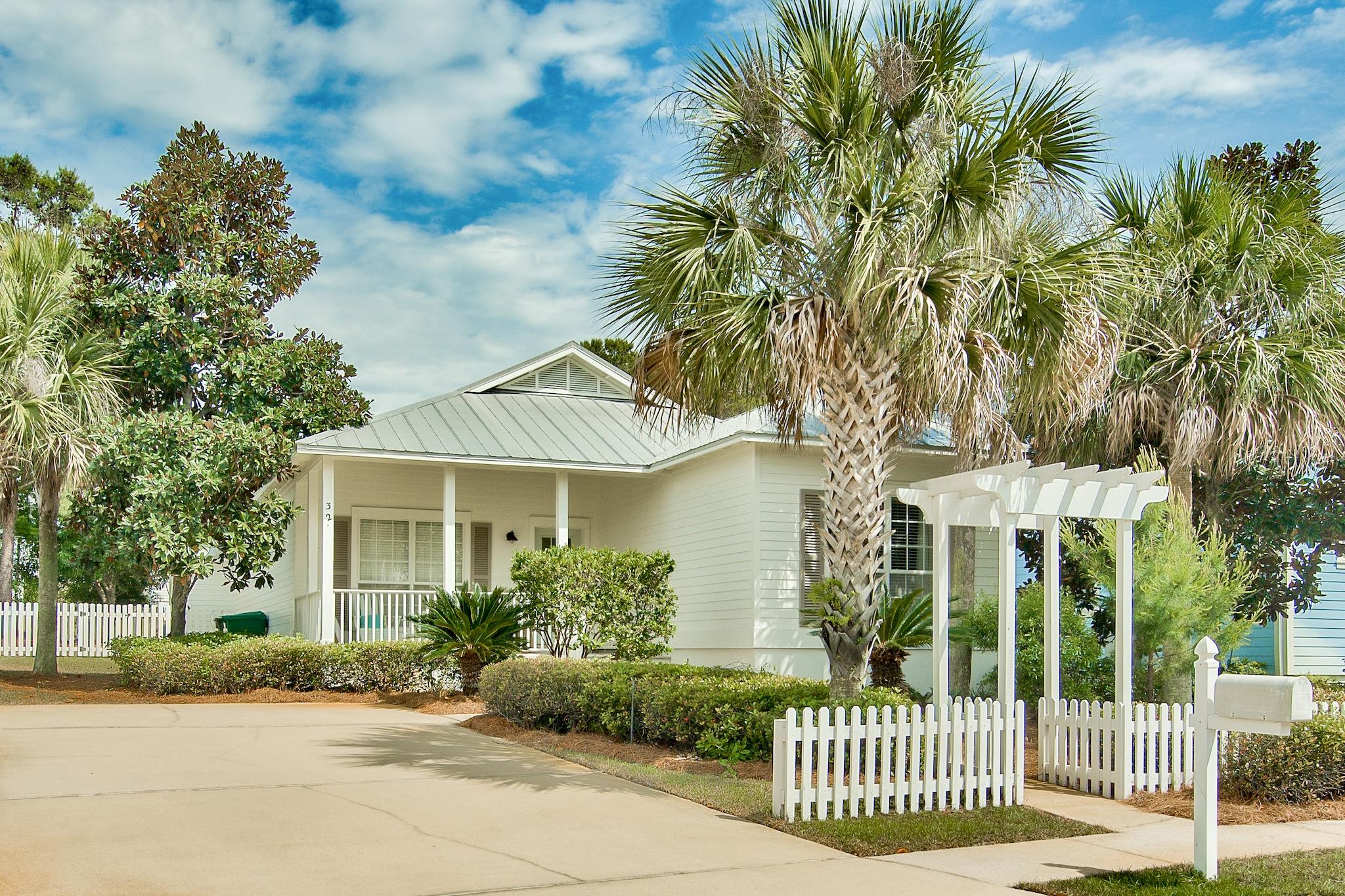 Charm is everywhere at this quintessential Florida cottage located in the non-rental community of Sea Dunes just steps from the public beach access in Dune Allen. Meticulously maintained and move-in ready, this 3BR/2BA home offers coveted features such as a split floor plan, gorgeous real pine floors, two covered porches and a white picket fenced back yard. A spacious open living room offers ample room to relax while a separate dining room is perfect for hosting friends and family. The bright white kitchen features granite countertops, a custom backsplash and a large breakfast bar. The master suite features a large double vanity in the ensuite bathroom, and the two guest rooms are generously sized. Exterior features include a metal roof, hardie plank siding and established landscaping. Upscale furnishings are negotiable if desired. Sea Dunes is an established neighborhood with sidewalks conveniently located near public beach access, the Gulf Place town center, local restaurants and Van R Butler Elementary.