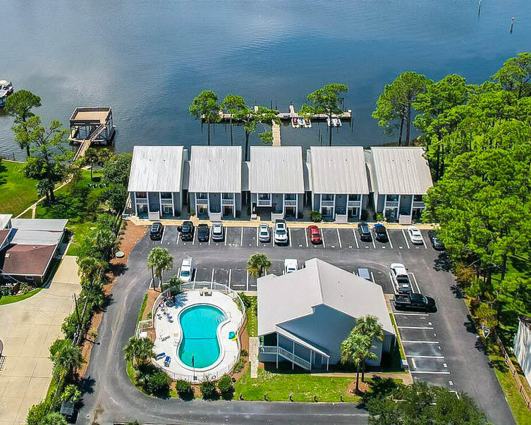 REDUCED FOR CASH BUYERS ONLY with a Quick Close Date at this fantastic price. NEWLY RENOVATED condo w/ boat slip accessibility Last chance to purchase as this is going on rental market- Thisspacious 2 bed / 2 bath with a partial water view,. Lots of light coming through the many windows. Located in a very small waterfront community with gates at theentry. Close to Naval Activity Station and many restaurants along Thomas Dr. 7 minute drive to Beach. The 2nd floor loft bedroom has its own bath. Unit F4quietly sits back off of North Lagoon approx 100ft. High Ceilings on both first and 2nd floor bedroom. The downstairs living room has a good size covered patiooverlooking the beautiful pool. Parking is directly out in front of unit. Pets allowed. This unit is a great long-term rental.
