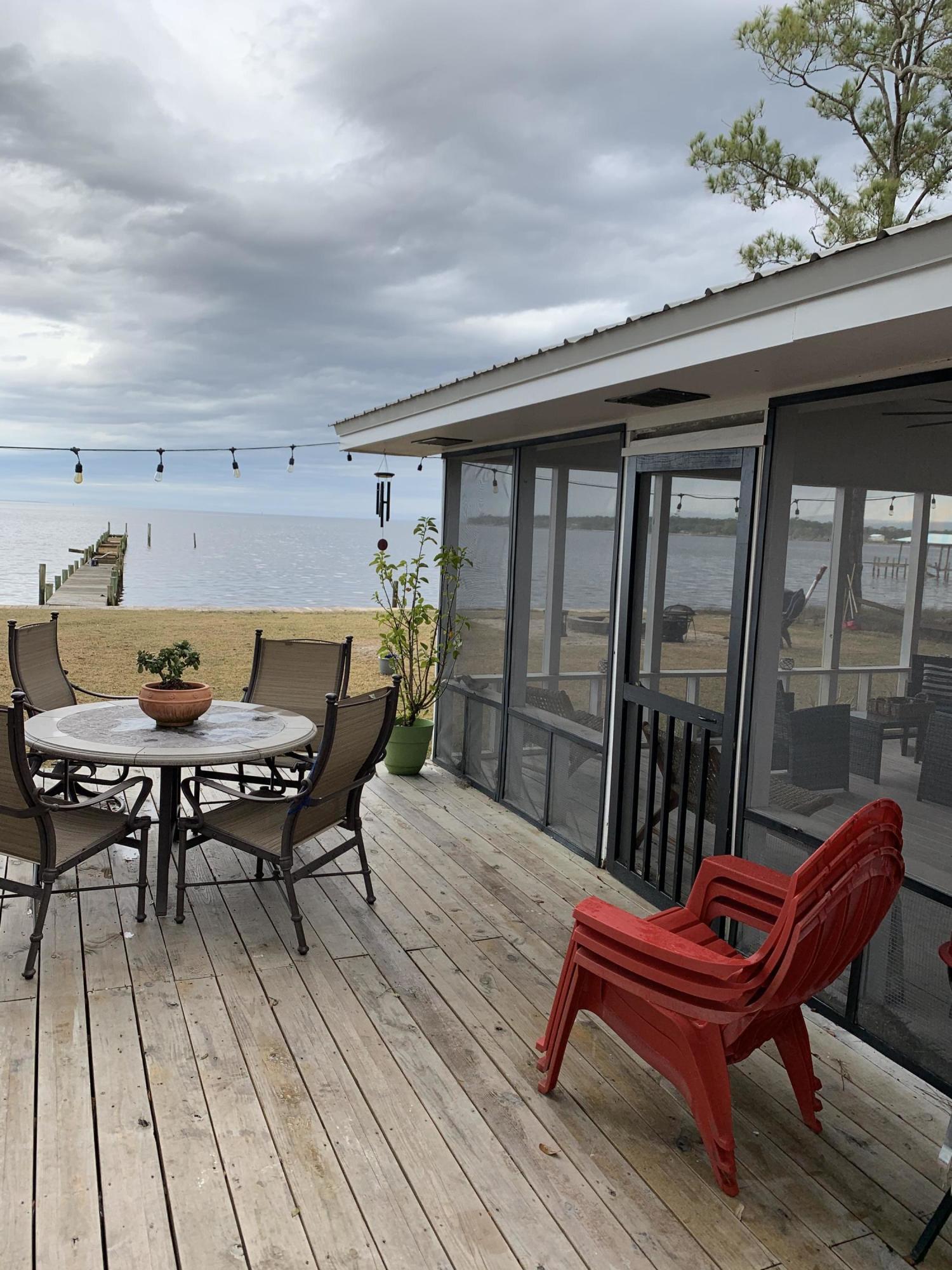 Great waterfront Florida Cottage just remodeled and overlooking the length of Choctawhatchee Bay. The large lot has 80 feet on the bay with large oak trees and beautiful views. The home has just been painted inside and out, new kitchen and new bathrooms The living room has a nice fireplace for the cool nights. The home has a large sunroom and huge screen porch on the back. The sunsets are amazing from this home. lots of storage and room with this place. Plenty of room for an addition if you need more space. This place is ready for you!!!