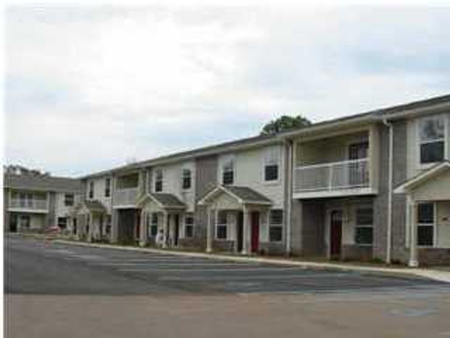 Beautiful town home with over $12,000 in improvements. Sparing no costs, the owner of this two bedroom unit has turned a cute town home into a beautiful one. Improvements include new flooring, with wood laminate floors in the living area, bedrooms and stairs, and porcelain tile in kitchen and laundry. This town home features solid surface counter tops in kitchen with a handy corner buffet for extra storage. Also featured are updated light fixtures, fans and plumbing fixtures. Windows include wood mini blinds and the homeowner has recently installed Pella storm doors on both front and back doors. The interior was repainted in 2012 and the HVAC is on scheduled maintenance program.The washer, dryer and refrigerator stay! This town home is located in a quiet neighborhood and has a pool too!