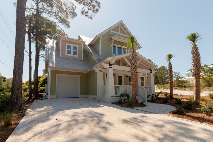 Gorgeous 4BR/3.5BA, modern home just a short walk to the beach. This beautiful home features vinyl wood flooring throughout with white walls and wood accents. The living space is large and opened, with soaring ceiling and plenty of windows. The kitchen features granite countertops, white appliances with copper accents, gas cook-top, & large kitchen island with breakfast bar. Living room has a gas fireplace & access to the covered back porch. The master suite features a large walk-in closet, double vanity, large walk-in shower, & a sitting area. Upstairs you will find a landing overlooking the living room, 3 large bedrooms, & laundry room. Other features include an oversized 1 car garage & tropical landscaping. Close to the beach, restaurants, shopping & more.