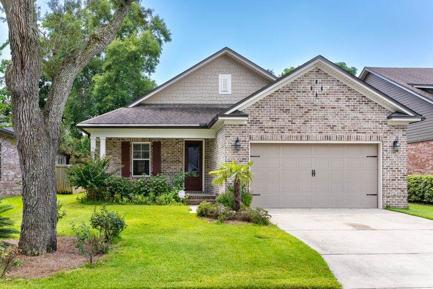 PRICE ADJUSTMENT!! Florida Coastal Craftsman Design home built by Randy Wise Homes located in the private community of Hattie's Grove in central Niceville. This open concept home features 4 bedrooms and 2.5 bathrooms. The kitchen is the heart of this home offering a large center island, stainless appliances and an abundance of cabinets and counter space. The home is easy maintenance with wood laminate flooring in the living areas, tile in the bathrooms and laundry and carpet in the bedrooms. The large master suite features a bath with a soaking tub, separate shower, walk-in closet and double vanities. This home was the model home and it still shows like a model home.  Noteworthy features include HVAC (2020), plantation blinds, hurricane shutters, sprinkler system and alarm system.