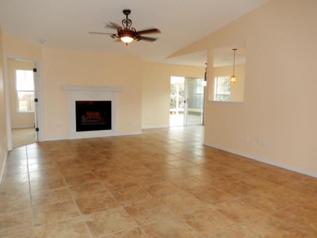 FANTASTIC, TOTALLY RENOVATED HOME! High, vaulted ceilings & a wood carved fireplace make an immediate impact upon entrance. Custom Minka light fixtures provide elegance in the spacious, tiled great room and dining area. The newly renovated kitchen with beautiful new granite counter tops, new cabinets & sink, stainless appliances which include refrigerator, new stove, dishwasher & microwave, custom under cabinet lighting and new light fixtures will be the gathering place for everyone. The spacious master, which is located away from the other bedrooms, adjoins the luxurious master bathroom with new granite counters, tiled floor, new light fixtures & shower enclosure. The 2nd bathroom also offers a new granite counter, tiled floors, new light and bathtub.