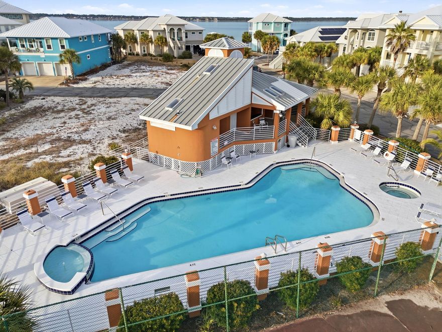 WATERVIEWS and HOUSE PLANS convey with this lot in the highly coveted neighborhood of Caribbean Isles.  This gated community is the ONLY neighborhood on Navarre Beach to offer a swimming pool, hot tub and tennis courts.  Short stroll, bike ride or golf cart ride to the multiple public beach accesses.  The National Seashore offers miles of paved roads to cycle, walk or jog with scenic, pristine views of the Gulf of America and Santa Rosa Sound.  Navarre Beach is home to shops, restaurants, nightlife and fun events such as the Mardi Gras and Christmas Parade. The house plans are stunning with multiple decks to capture the waterviews, 4 bedrooms, 3 1/2 baths, a second-floor lounge and a 3-car garage. Caribbean Isles allows for short term rentals so once built; you can easily project $75,000 in rental income.  There are very few available lots on Navarre Beach.  Don't miss one of the rare opportunities left to build your dream home on an island!