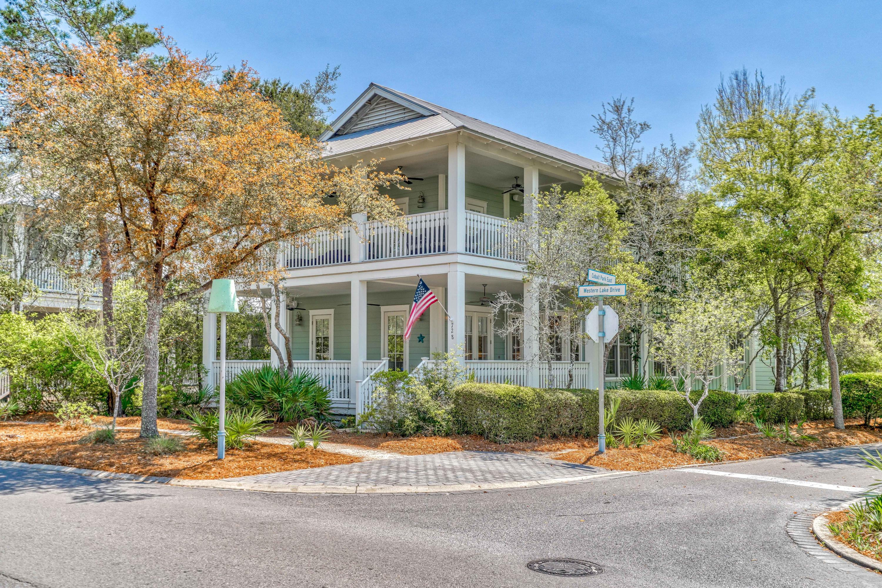 Stunning Watercolor home on Large Corner Lot designed by TS Adams Studio located just steps to the Watercolor Beach Club, Town Center and the back entrance of Seaside. This home features over 1,700 sqft of wrap around porches, an oversized two car garage with extra storage space, a beautiful carriage house with separate living room and bedroom, an outdoor shower and more. There is a master bedroom on the main floor with secondary master upstairs equipped with a private screened balcony. Spacious open floor plan on the main level with an additional living area upstairs. There are beautiful hardwood floors throughout, high ceilings and a gourmet kitchen with large island and gas grill. Rental Machine and sleeps 14 comfortably. Room for a pool with renderings and estimates available.