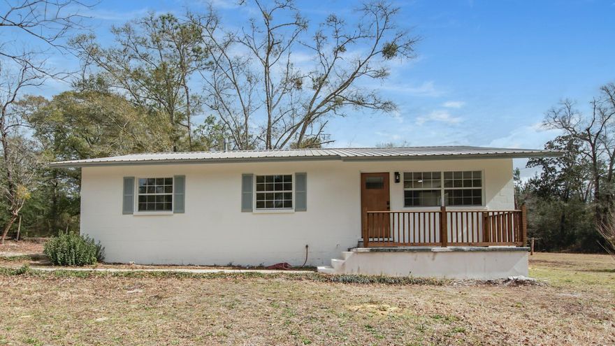Completely renovated and move-in ready, this 4-bedroom, 2-bath home is located just minutes from the historic heart of downtown DeFuniak Springs. Taken down to the studs and thoughtfully rebuilt, the home offers the charm of a classic ranch with the peace of mind of major system upgrades already completed. Recent improvements include a new HVAC system, new water heater, LVP flooring throughout, new doors, new cabinetry, fresh paint, new stainless-steel appliances, recessed lighting, updated fans and fixtures, and large-format tile in both bathrooms. The bathrooms have been fully refreshed with new showers, vanities, and toilets, offering a clean, modern feel.Situated on a spacious .43-acre lot, the large backyard offers privacy and plenty of room to enjoy outdoor living, create a garden, entertain guests, or simply relax in your own space. Conveniently located near local shops, restaurants, parks, schools, and the iconic Circle Drive, this home provides easy access to everything DeFuniak Springs has to offer while delivering the durability and strength of solid concrete block construction. This is a rare opportunity to own a fully updated home in a desirable in-town location.