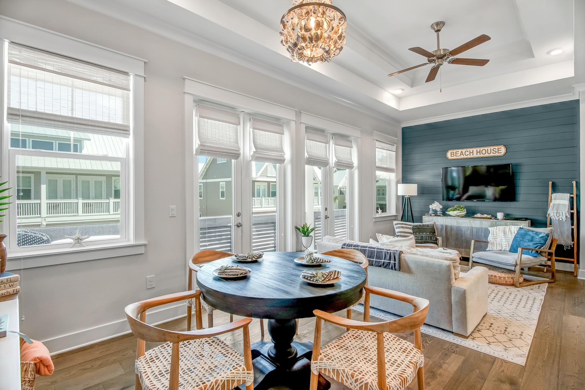 Quite possibly the most well-appointed townhome in all of Prominence! This luxury two bedroom, two bath unit has been professionally decorated with high-end finishes and furnishings throughout. Custom shiplap, designer lighting fixtures, custom rope railing, Quartz countertops, and hardwood floors throughout are just a few of the notable features. The upgraded kitchen features stainless steel appliances, and there are tray ceilings and crown molding throughout. In the master suite, you'll find a walk-in closet and a frameless glass shower. Located just a short walk from the beautiful, oversized community pool. This townhome has excellent rental history! Prominence amenities include a beach shuttle, Fitness Center, and the shops & restaurants of The Hub just across the street.
