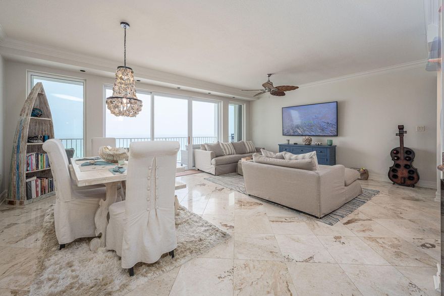 Experience coastal living like never before in this spectacular beachfront end-unit condo, perfectly positioned on the 3rd floor with breathtaking, unobstructed Gulf views from nearly every room. From the moment you walk in, the panoramic beauty of the beach draws you in--captivating your eyes and soothing your soul.Step onto the expansive 50-foot tiled balcony, accessible from the living area and both bedrooms, and soak in sweeping sunrise and sunset vistas that stretch across the horizon. Whether you're sipping your morning coffee or unwinding with an evening glass of wine, this space becomes your personal slice of paradise.This 2-bedroom, 2-bath luxury retreat offers an open-concept layout designed for entertaining, featuring elegant marble flooring, a built-in wet bar with wine cooler, and a seamless flow between the living, dining, and kitchen areasall with uninterrupted Gulf views.

The chef's kitchen is equally impressive with granite countertops, stainless steel appliances, timeless sophisticated cabinetry crafted for both beauty and durability.  The  convenient adjacent laundry room with sink doubles as a pantry and utility area.  

The split style bedroom affords enhanced privacy for both homeowners and guests.  The guest bedroom is generously sized, ideal for relaxation or even a flexible sitting or office space, and opens directly onto the balcony. The guest bath offers a beautifully tiled walk-in shower and private vanity area.

The primary suite is a peaceful sanctuary, beginning with a spacious dressing area and leading into a luxurious bath featuring a jetted tub/shower combo with handheld option, dual granite-topped vanities, and serene views that start every day with inspiration.

Additional features include a rare, hard to find 2-car tandem garage PLUS a private storage unit, and additional space at the back of the building for your beach essentials. Yes, you have found a unicorn on the beach. 

Compass Rose is a sought-after Gulf-front community offering 300 feet of private beach, a fitness center, a rooftop observation deck, a children's play area.  Do the beach VIP style with seasonal beach service (March-October)all included in your HOA dues. This is the way life is suppose to be.  You have earned it. 

Rental Policy: Minimum 31-day rentalno short-term staysensuring a peaceful mor private atmosphere without the constant turnover of vacation traffic.  Enjoy a true coastal lifestyle among like-minded neighbors.  