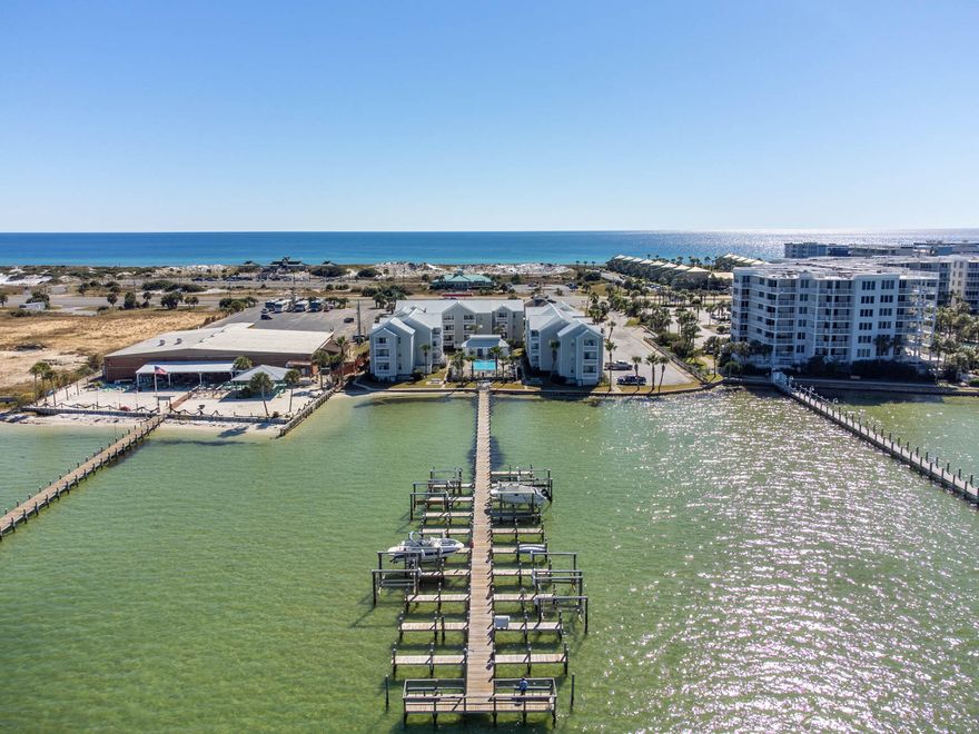 Sellers have multiple bookings already for spring & summer!! Welcome to HERMITAGE CONDOMINIUM on Okaloosa Island in Fort Walton Beach where you're surrounded by both the bay & the beach! This fully renovated, 2nd floor condo features 1 very large BR, 1BA, a bunk room with custom narrow twin beds, a laundry room, & a balcony overlooking the pool & bay! It can sleep 6 comfortably! It's been a short term rental since September of 2021 & grossed $44,035.43 for 2022! (Sellers self maintained bookings & cleanings!) A local's favorite beach (John Beasley Park) is right across Hwy 98 from this condo! Great news - VA loans are acceptable here! The HOA covers water, sewer, trash, internet, cable, grounds keeping, community pool (w/ bathrooms), 2 outdoor grills, 2 picnic tables, & access to the bay!