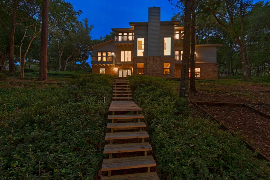 LAKEFRONT LIVING in the Heart of Niceville! Sit on your private dock and soak in the gorgeous views, or cast a line while enjoying the serenity this property has to offer. This must-see custom built home in Rocky Bayou Estates on Lake Werk is situated on a large .62 acre lot, and boasts 4 bedrooms, 4.5 bathrooms, and 4,128 +/- square feet of living space! The thoughtfully appointed layout offers panoramic water views from nearly every room of this tri-level home.Everything you need is on the elevated main level, which features soaring 18' ceilings in the foyer and living room, with 8' windows overlooking the lake that bathe the room in natural light. Also located on this level is the updated kitchen, complete with Wood-Mode cabinets, Electrolux double oven and range, granite