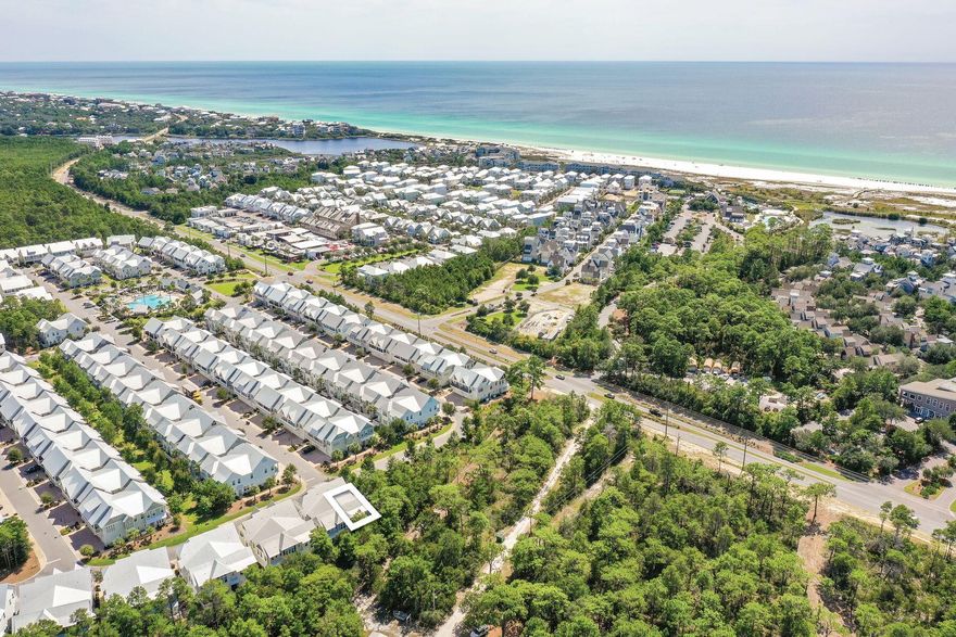 Completely surrounded by lush preserved land, this highly desirable A unit in the neighborhood of Prominence offers the best combination of privacy and convenience with a newly replaced HVAC. Bordering wooded areas yet near the front of the neighborhood, this A unit offers close proximity to neighborhood amenities, the shops and local restaurants of The Big Chill and the bike path running along Scenic Highway 30A. With immense natural light, the living and dining areas provide ample space to entertain or relax with family and friends after a long day at the beach. The bright coastal decor offers a fresh and inviting retreat. The kitchen is designed with the modern chef in mind with a gas range, gleaming stainless steel appliances, pristine granite countertops and a large center island with a breakfast bar.art Beyond the living area, double doors lead to the rear porch perfect for alfresco dining or morning coffee with tree-lined views. The first level is also nicely appointed with a powder bathroom, dedicated laundry room and spacious owner's closet. A staircase leads to the second level where the master suite along with two guest bedrooms and a shared full bathroom can be found. The master suite offers large windows overlooking the preserved land with ample natural light flowing through and a large bathroom with a walk-in shower, double vanity and spacious walk-in closet. The two spacious guest suites offer wooded views and access across the hallway to a full guest bathroom. The location of this home is perfectly suited as both a rental investment and second home. The private two-car attached garage is an added convenience for those wanting to store the included six-seater golf cart, bicycles and beach toys or personal vehicles. Prominence offers many community amenities including a large lagoon-style pool, grilling areas and a fitness room. The Big Chill is located in the heart of Prominence hosting an array of community events, football game viewing, concerts, shopping and popular local eateries.