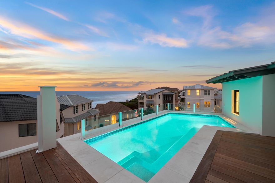 Expertly crafted by Old Seagrove Homes, this exceptional 6-bedroom, 7.5-bathroom residence offers over 6,000 square feet of thoughtfully designed living space in the heart of Seagrove Beach. Perfectly situated between two beach accesses, the home captures panoramic Gulf views and reflects an elevated standard of coastal architecture and craftsmanship.A rooftop pool and fifth-floor observation deck create an unmatched outdoor experience, offering sweeping vistas of the Gulf that serve as a serene retreat or a dramatic backdrop for entertaining. Every detail of the outdoor design speaks to refined coastal living at its highest expression. Inside, French limestone and wide-plank white oak flooring are laid in a striking herringbone pattern, bringing warmth, texture, and timeless character to the space. Custom cypress built-ins, including a walk-in pantry wrapped entirely in cypress, showcase meticulous attention to detail and a commitment to quality materials.

Venetian plaster walls add a soft, luminous texture that elevates the interiors with understated elegance. A custom fluted wood banquette anchors the dining area with sculptural sophistication, while the brick fireplace offers a classic focal point that grounds the main living space.

Bathrooms are spa-inspired, featuring marble showers enhanced by subtle backlighting for a refined and immersive experience. Designer lighting throughout the home adds layers of ambiance and style, reinforcing the home's cohesive, high-end aesthetic.

With an expansive game room and a generous bunk room, the home is designed with both entertainment and family living in mind. This is a rare opportunity to own a meticulously constructed property in one of 30A's most coveted enclaves, where exceptional design, Gulf views, and proximity to everything Seagrove Beach has to offer come together seamlessly.