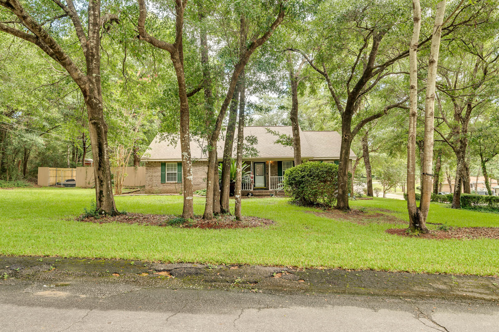 Rare opportunity to own a home in the peaceful Indian Trails subdivision. This quaint all brick home is nestled between several mature oak trees on a 2/3 acre wooded lot that creates a calming atmosphere. This beautiful home boast an open floor plan, upgraded luxury vinyl plank in the main living areas and a working gas fire place for those cooler months. The interior of the home has a fresh paint job throughout, modern light switches, upgraded GFCI outlets, all brushed nickel fixtures and handles, jetted tub in the master bath and all kitchen appliances were upgraded in 2021. Also a New carport that's perfect for the camper and a new fence, both installed in 2021. This home is move in ready for your family!