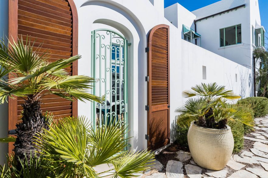 This custom designed 3 bedroom 3.5 bath courtyard home is fully furnished located within short walking distance to the Alys Beach Town Center. An entry Zaguan leads to the gracious courtyard with comfortable outdoor living space and fireplace. The home offers an open floorplan with large living area and fireplace overlooking the private courtyard. The kitchen's white cabinets and limestone countertops give this space an open clean look. The home offers a screened porch off the kitchen/dining area that accesses into the courtyard. A spacious first floor secondary master bedroom and bath are located just off the living room. There is a second-floor master suite with loggia. A third, private guest bedroom with bathroom is also located on the second floor. The home's signature The home's signature feature is a generous rooftop terrace that is perfect for entertaining and overlooks the Alys Beach Town Center.