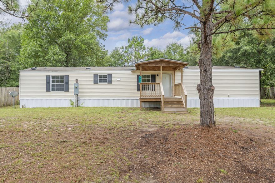 This 3-bedroom, 2-bathroom 2011 single-wide mobile home is nestled on over a third of an acre and features both a covered front and back deck perfect for morning coffee, weekend BBQs, or simply relaxing outdoors. The fenced backyard is great for pets, kids, or a little extra peace of mind. Inside, you'll find a functional split-bedroom floor plan with comfortable living spaces. The large lot offers room to play, garden, or expanda'giving you flexibility to make it your own.Whether you're starting out, slowing down, or looking for a smart investment, this property delivers space, charm, and value.