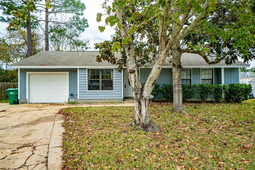 **Back on Market** Buyers received orders to a new location. Home Inspection and Repairs have been completed w/ clear WDO. Home appraised for more than list price! **Welcome home to this freshly painted 3 bedroom and 2 bathroom ranch located in close proximity to Northwest Florida State College. The eat-in kitchen features a full appliance package and the living room has a cozy wood-burning fireplace with brick, raised hearth. Every room has a ceiling fan for maximum comfort, and low maintenance tile and laminate wood flooring flow throughout the entire home. The one-car garage has an automatic garage door opener, plenty of wood shelving for storage, and space for your washer & dryer. Situated at the base of the cul-de-sac, there is ample space for your boat, RV, or even a swimming pool!